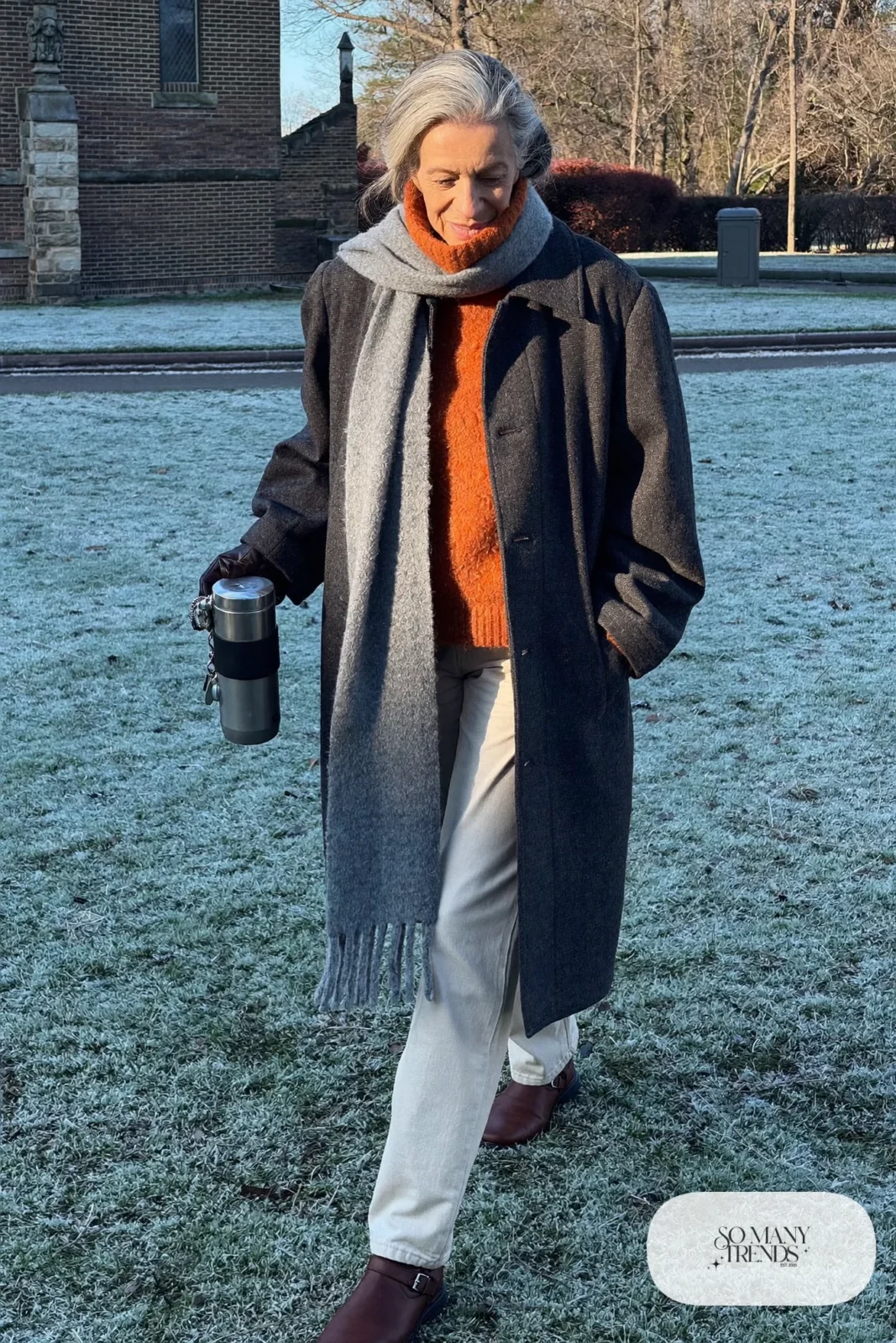 charcoal long wool coat over rust turtleneck, cream straight pants and brown ankle boots outfit 5