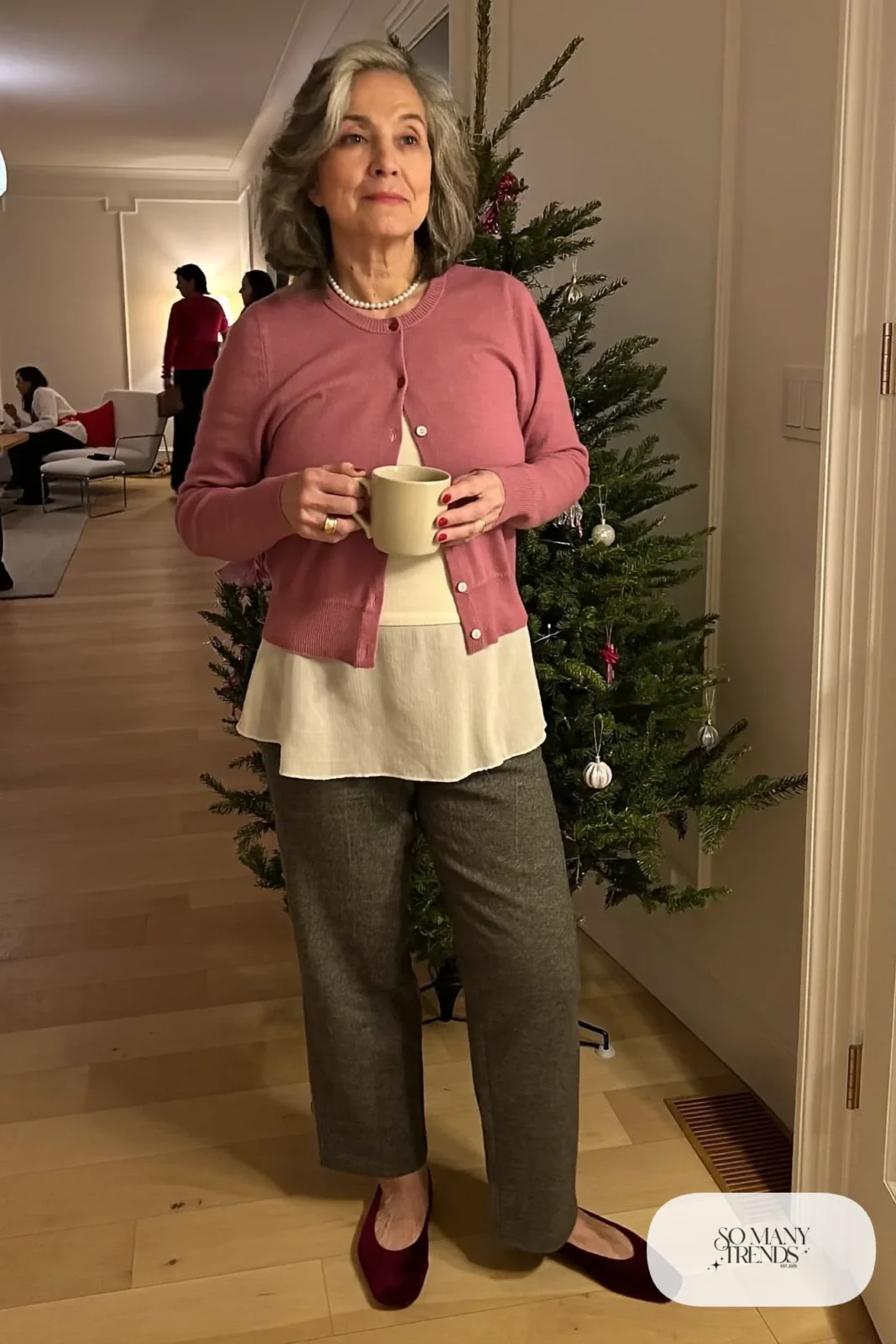 soft pink button cardigan with cream shell, gray wool pants, pearl necklace and velvet flats outfit 6