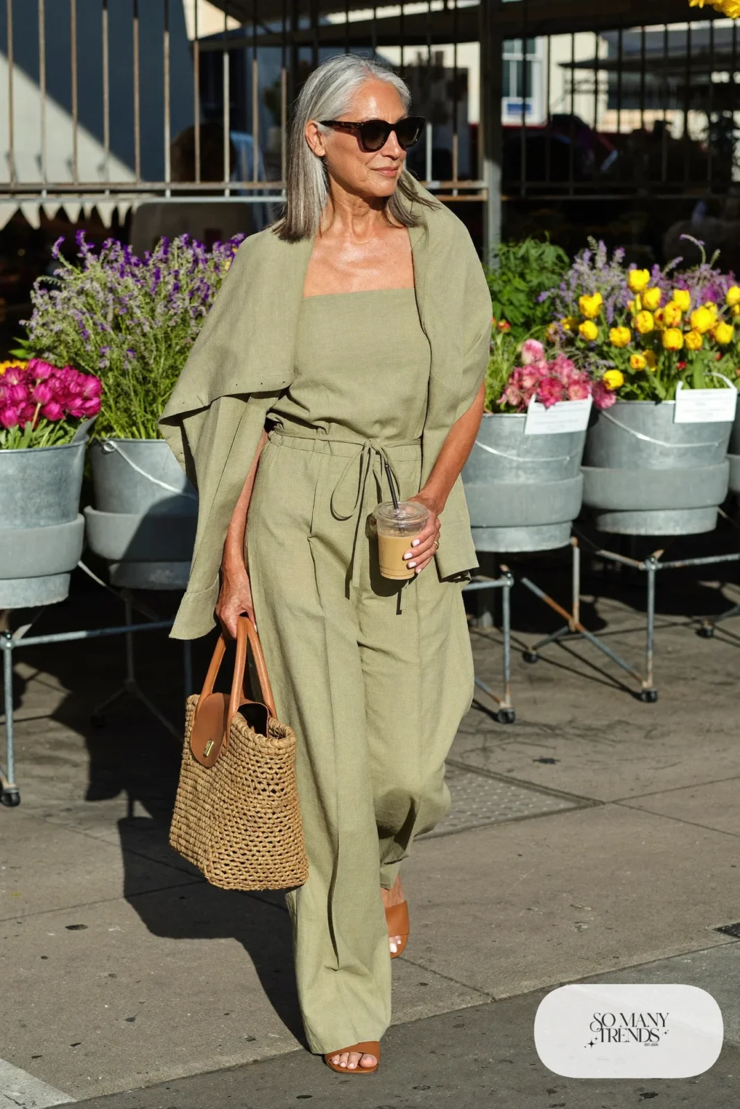 sage linen wide-leg jumpsuit with tan leather slides and woven bag outfit 15