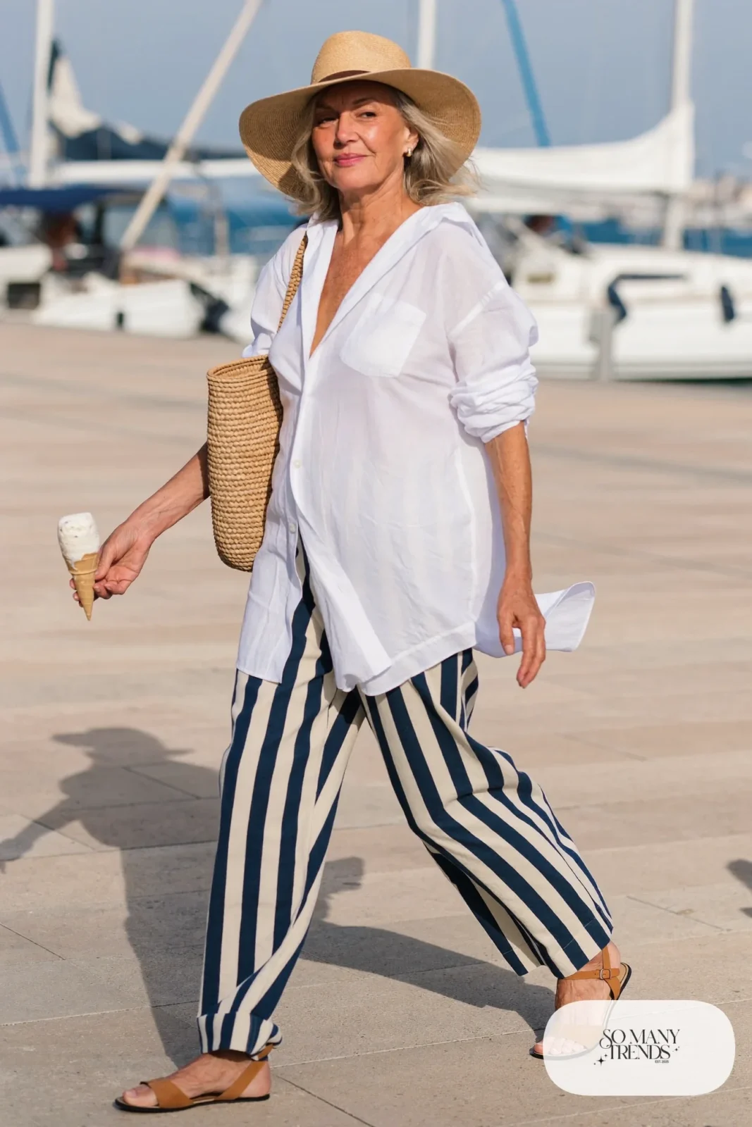 white linen shirt with navy striped wide pants, straw hat and flat sandals outfit 22