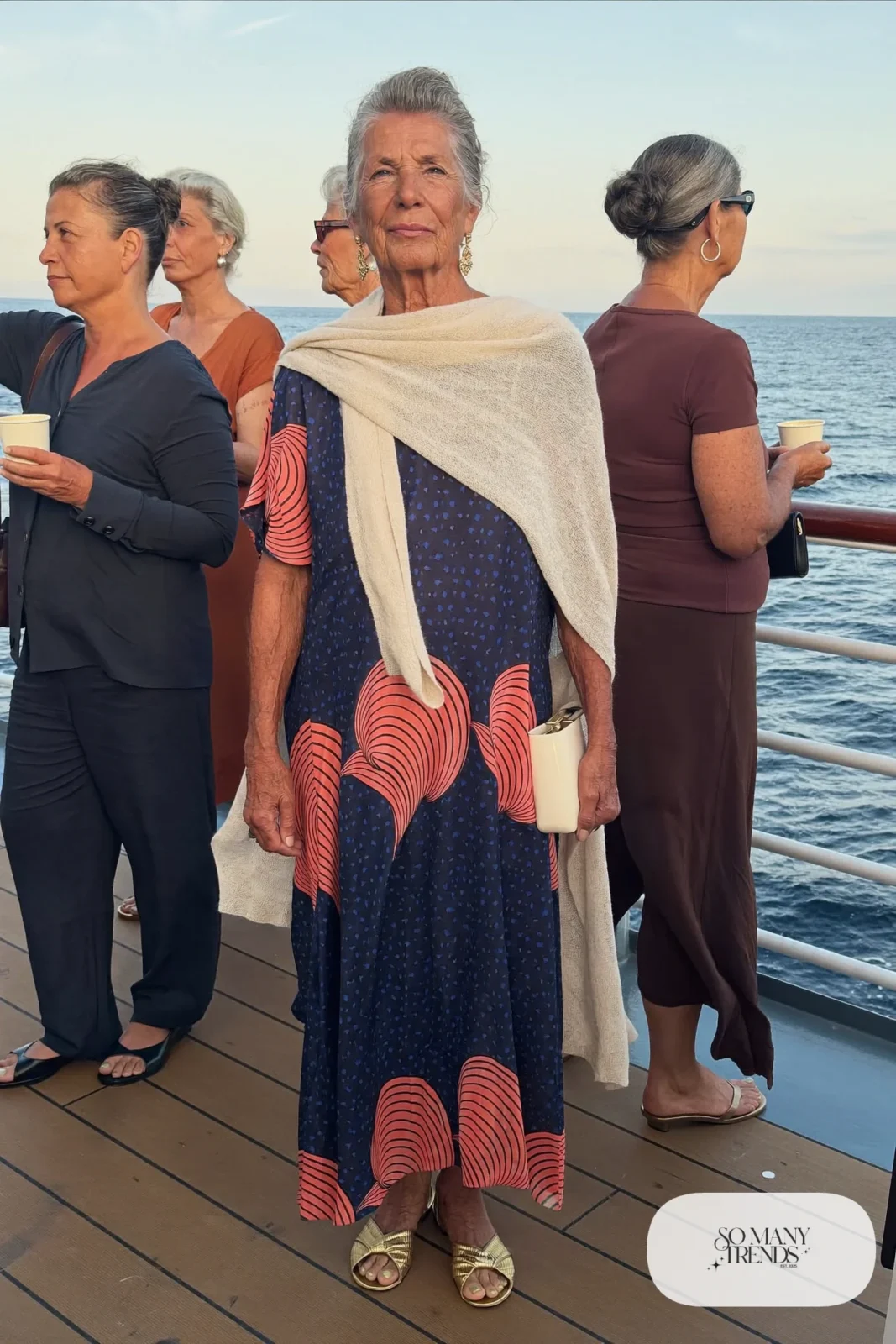 navy and coral printed maxi dress with cream pashmina and gold flat sandals outfit 23