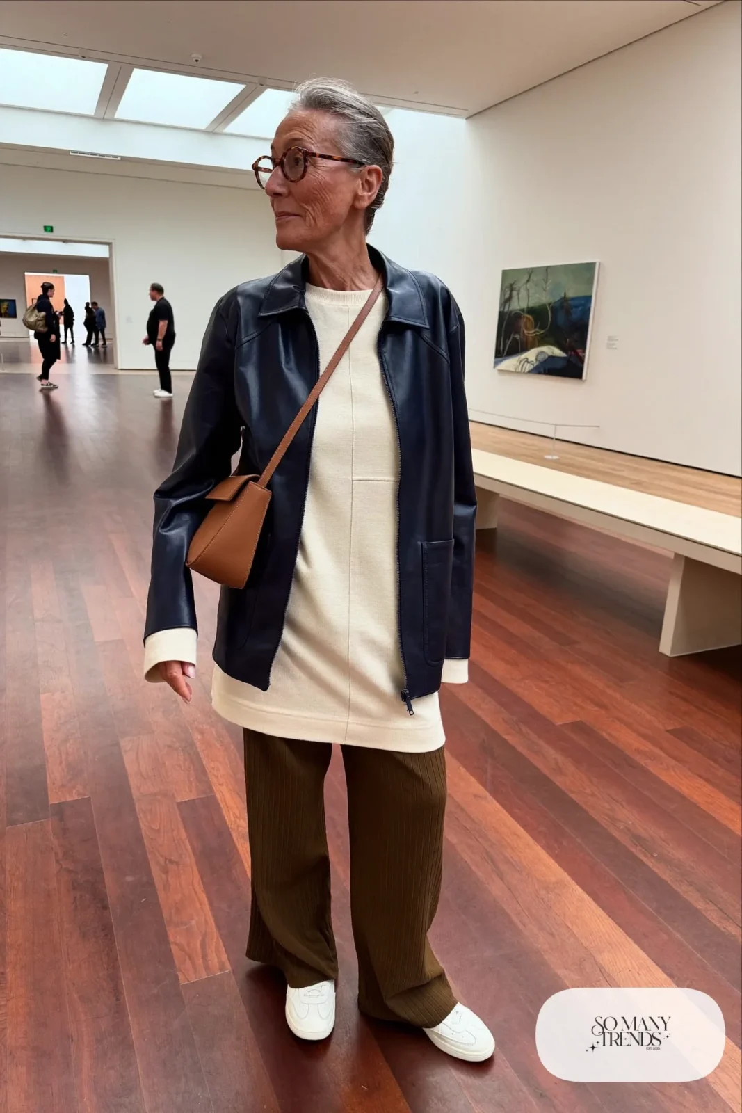 olive pleated wide pants with cream knit top, thin leather jacket and leather sneakers outfit 25