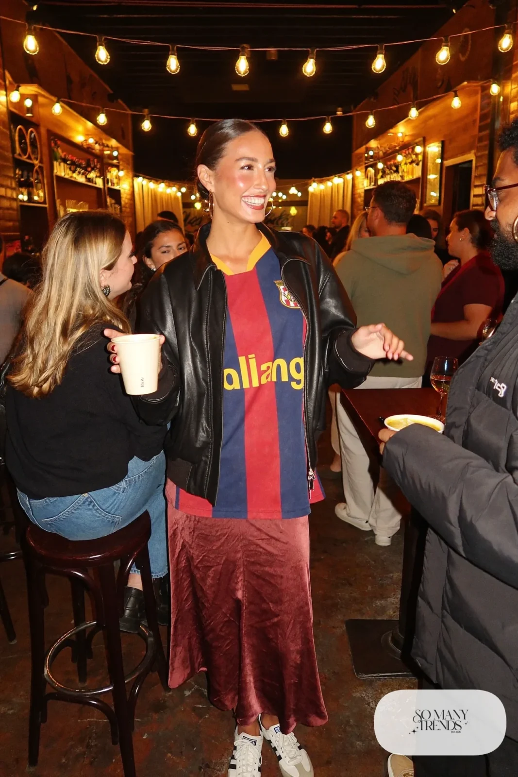burgundy satin midi skirt striped soccer jersey retro sneakers black leather jacket outfit 24