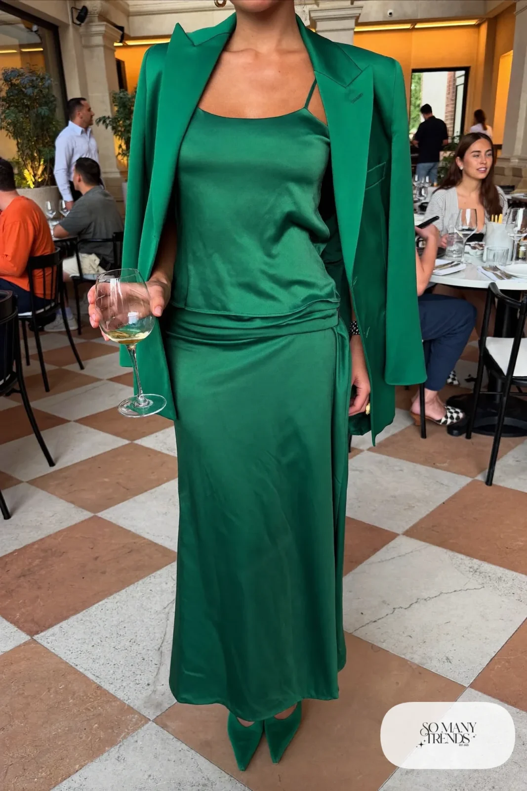 woman in emerald satin cami, long wrap skirt, blazer and pumps outfit 23
