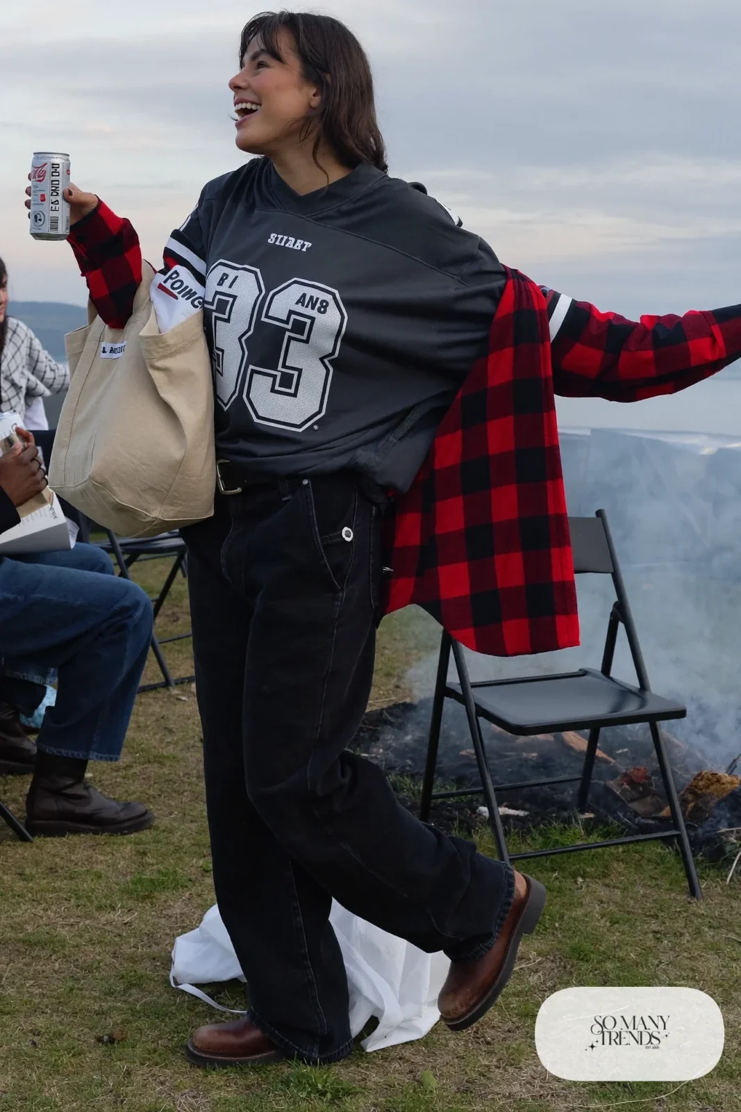 charcoal gray football jersey plaid flannel shirt relaxed black jeans brown boots canvas tote outfit 6