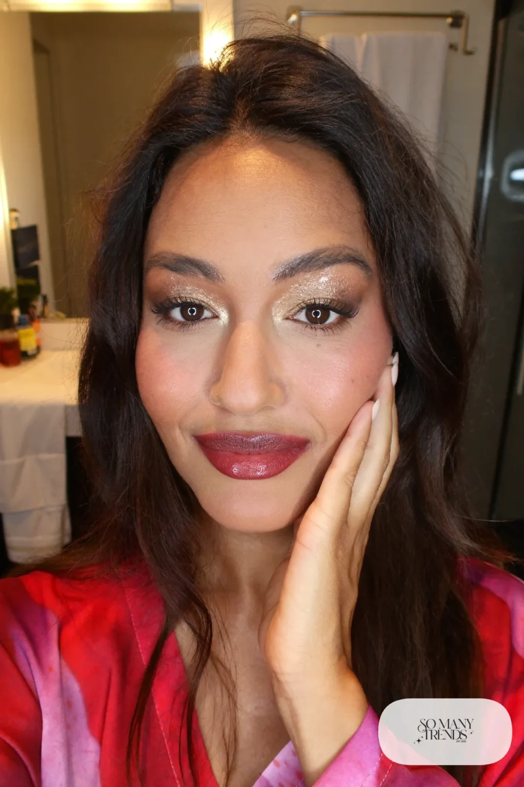 woman with bronze shimmer eyeshadow, warm brown lip and cream blush, makeup look 6