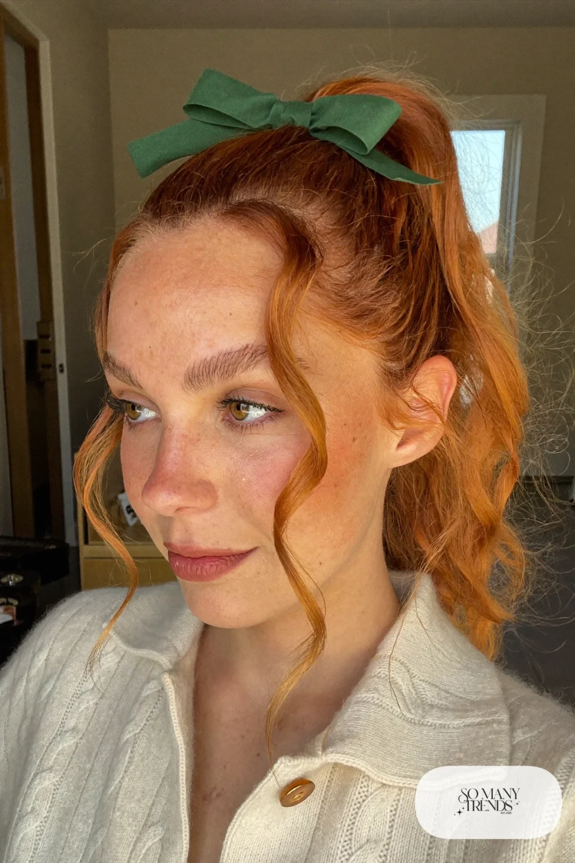 auburn wavy ponytail tied with forest green ribbon bow, simple makeup, hairstyle 5