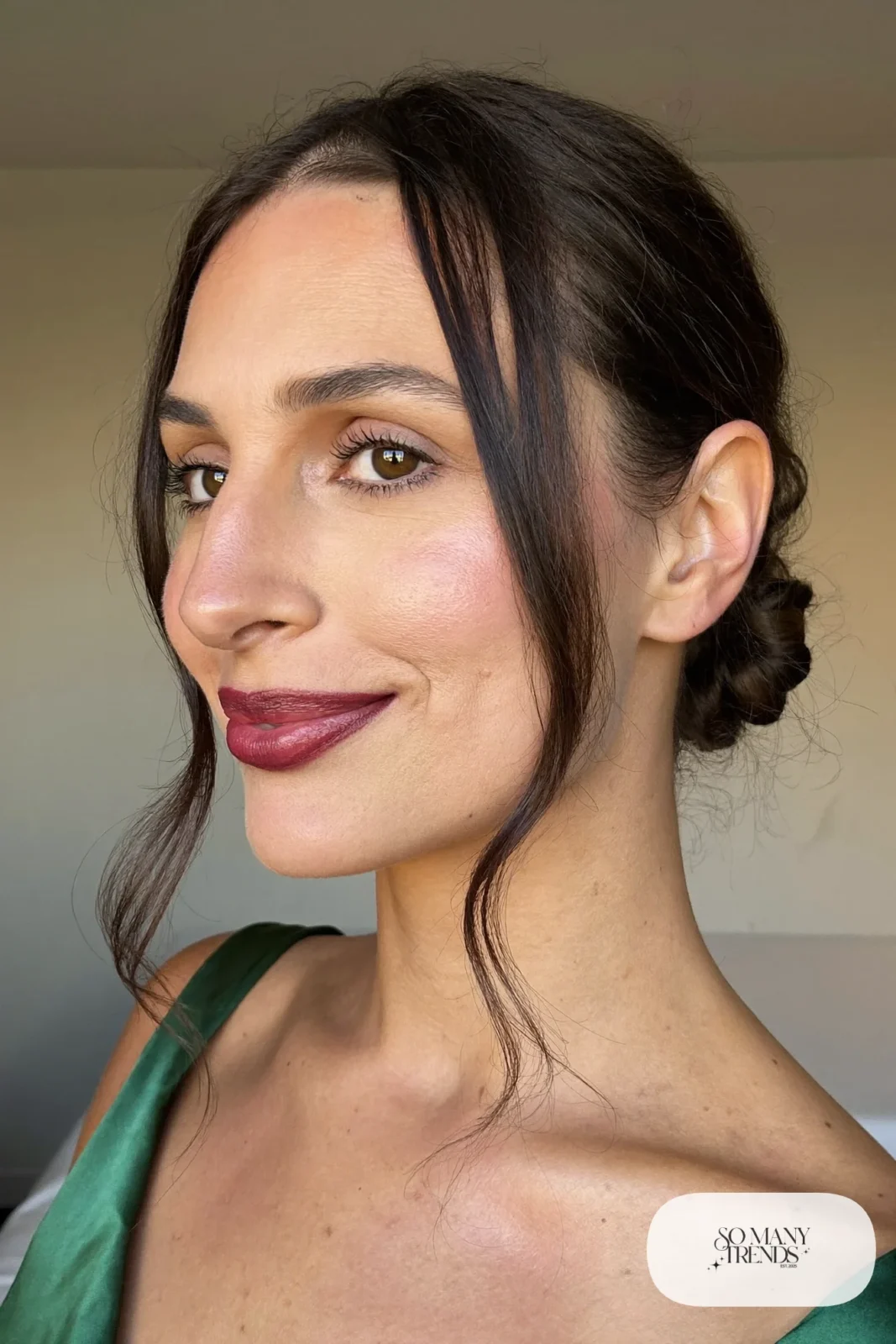low chignon on dark hair with curled face-framing strands, simple makeup, hairstyle 8
