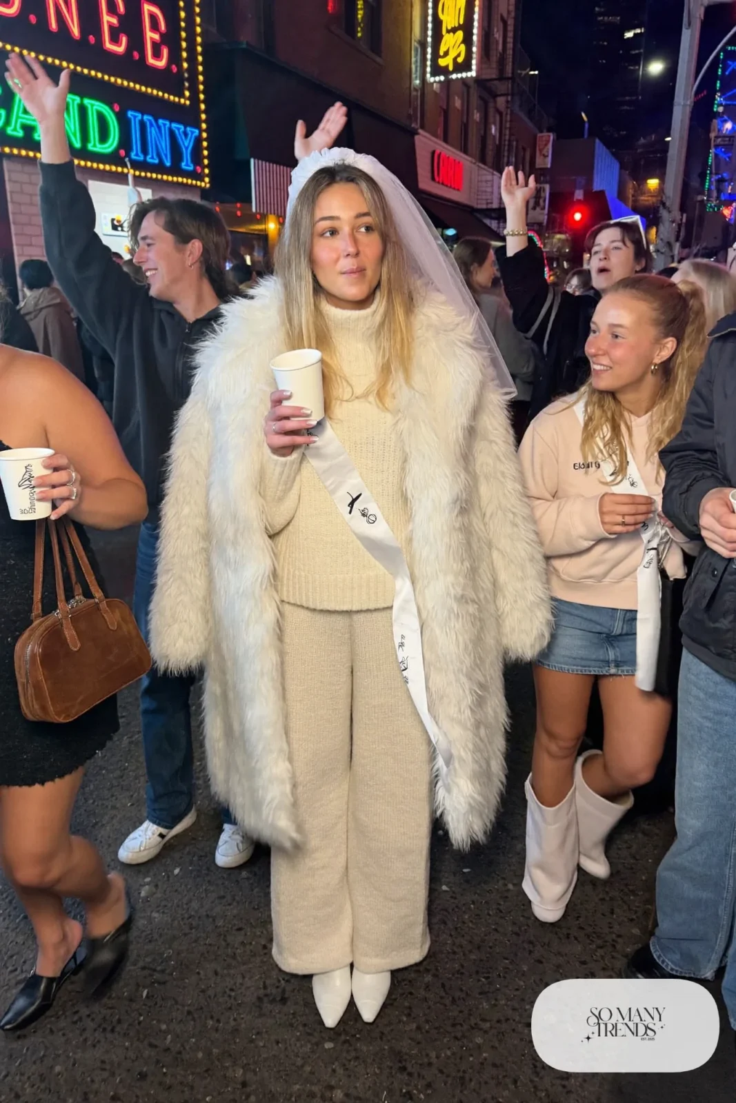 cream knit sweater and pants set white faux fur coat white boots bride nashville outfit 26