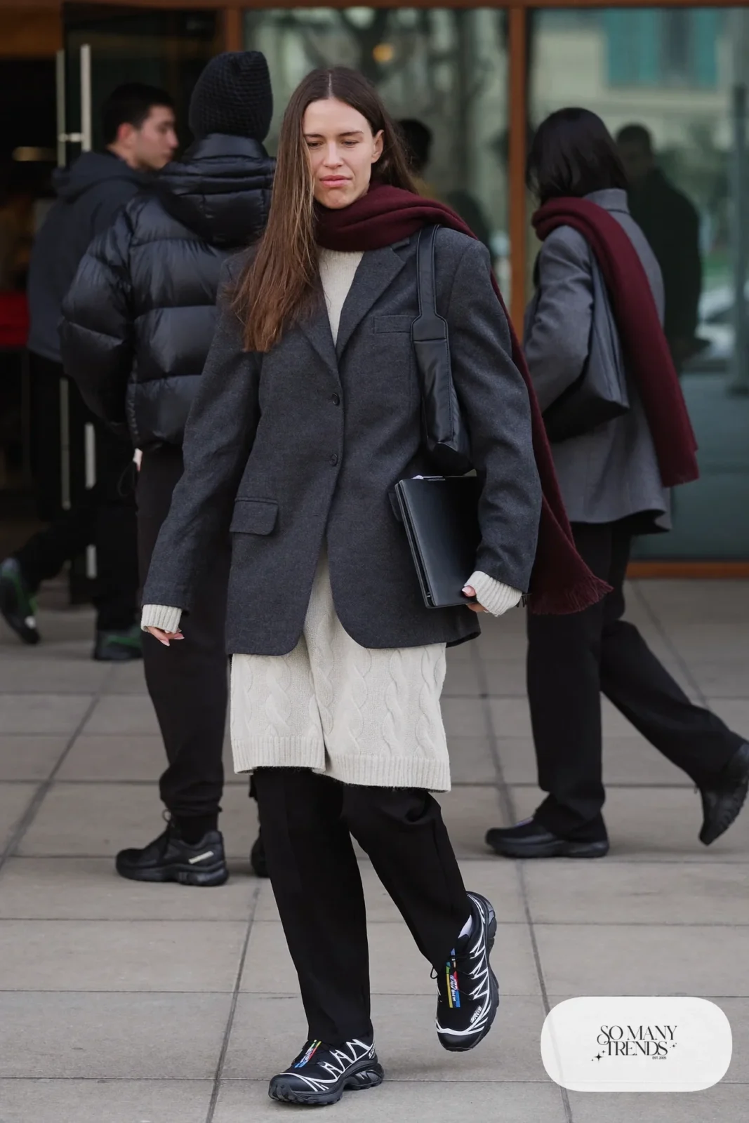 oversized charcoal blazer, cream chunky knit sweater, black barrel-leg pants, black Salomon ACS Pro sneakers outfit 5
