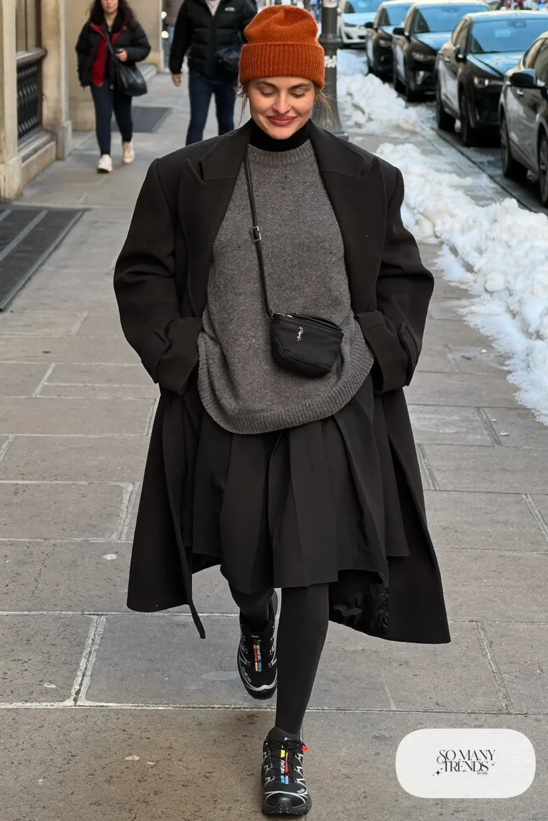 black pleated midi skirt, oversized gray sweater, black fleece-lined tights, black Salomon XT-Whisper sneakers, long coat outfit 7