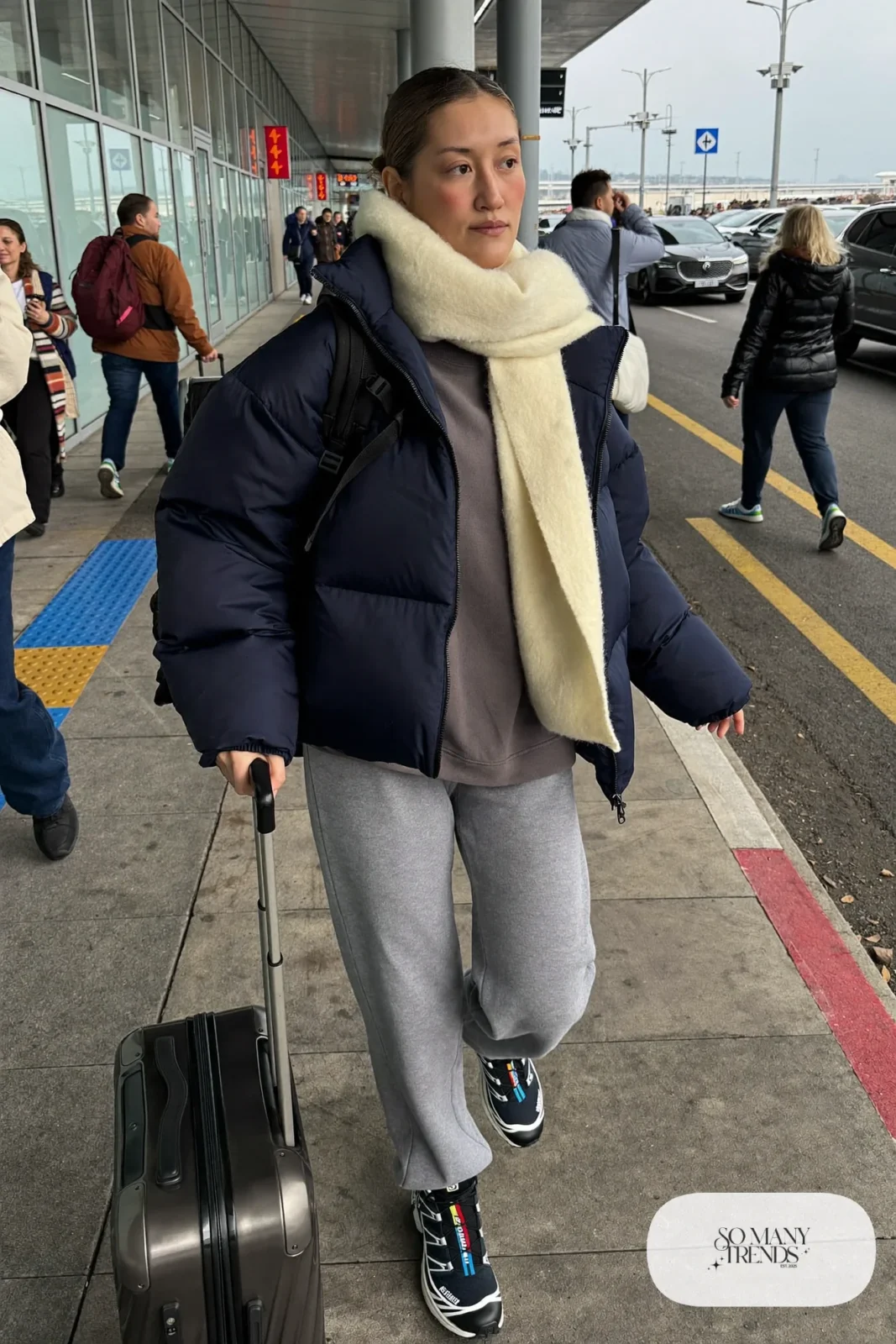 navy quilted boxy jacket, charcoal crew sweatshirt, gray joggers, black Salomon ACS Pro sneakers, backpack outfit 9