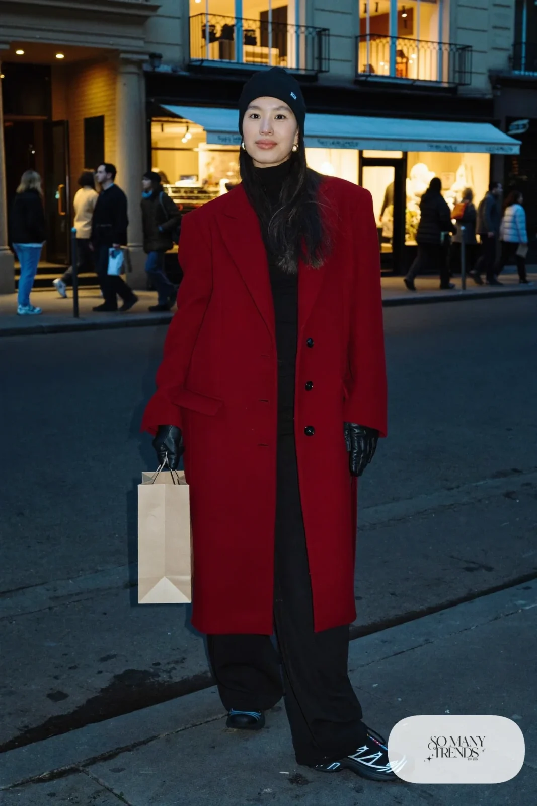 oversized long cherry red wool coat, black turtleneck, black wide-leg pants, black Salomon XT-6 sneakers, black beanie outfit 10