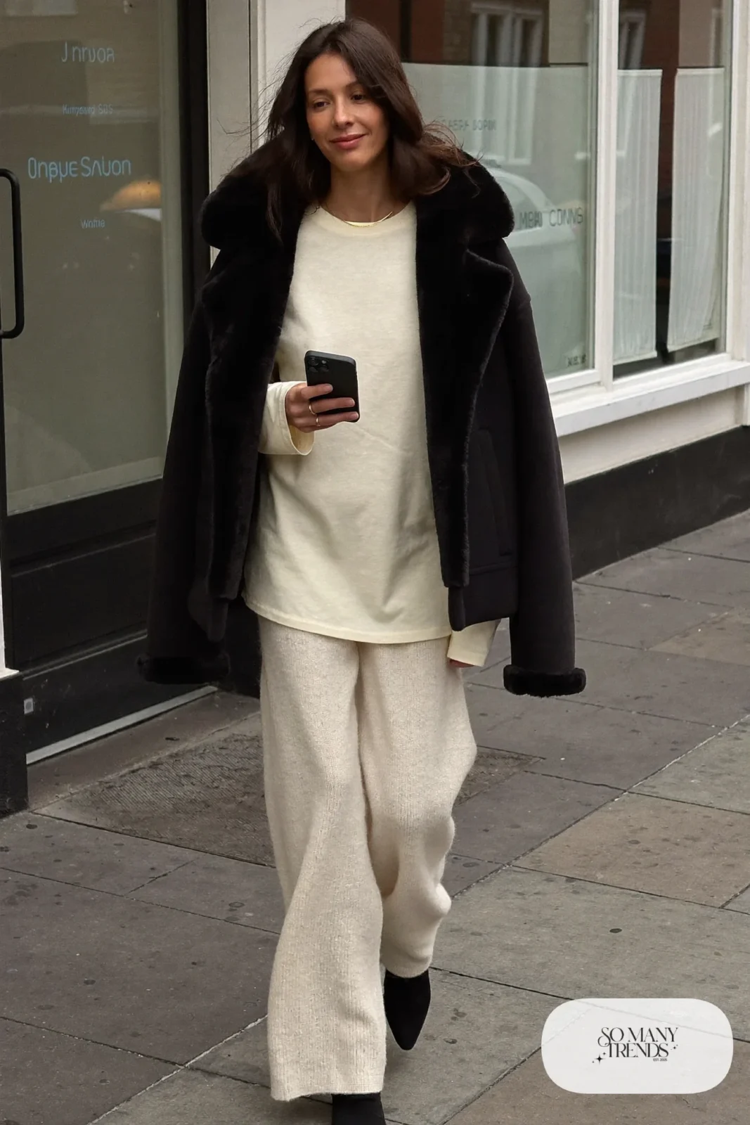 black faux shearling boxy jacket cream knit wide-leg pants black boots gold necklace outfit 27