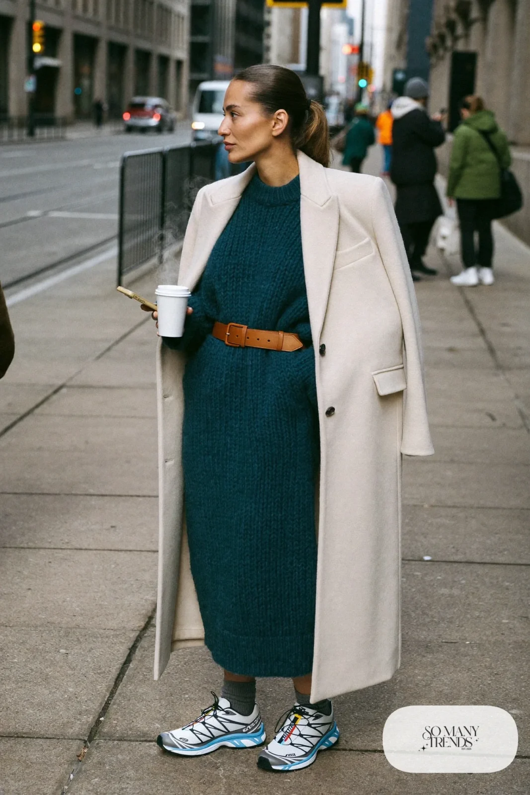 loose deep teal knit sweater dress, long cream coat, thick socks, white and gray Salomon XT-6 sneakers outfit 8