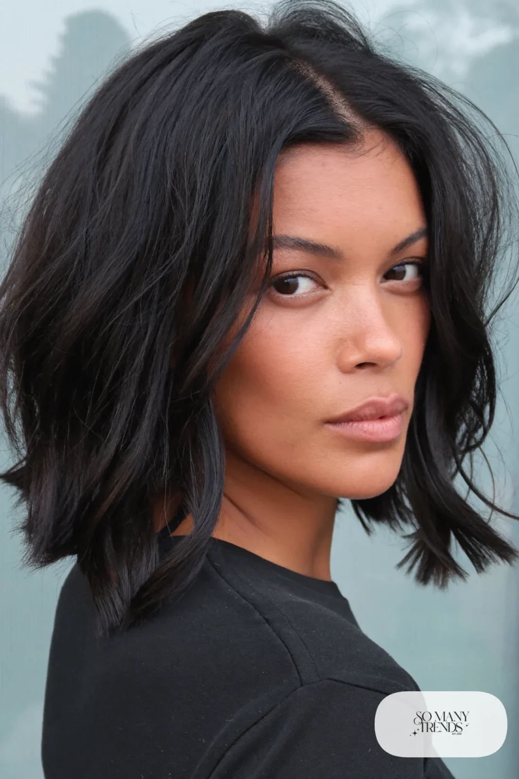 woman with jet black shaggy bob worn down, natural makeup, haircut 7