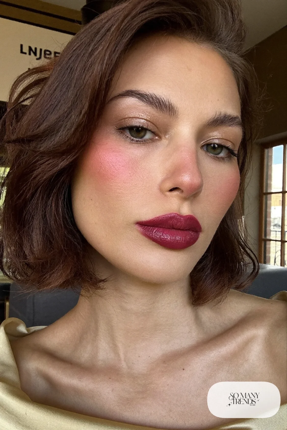 woman with cherry berry lip color, light blush and mascara, winter makeup look 3