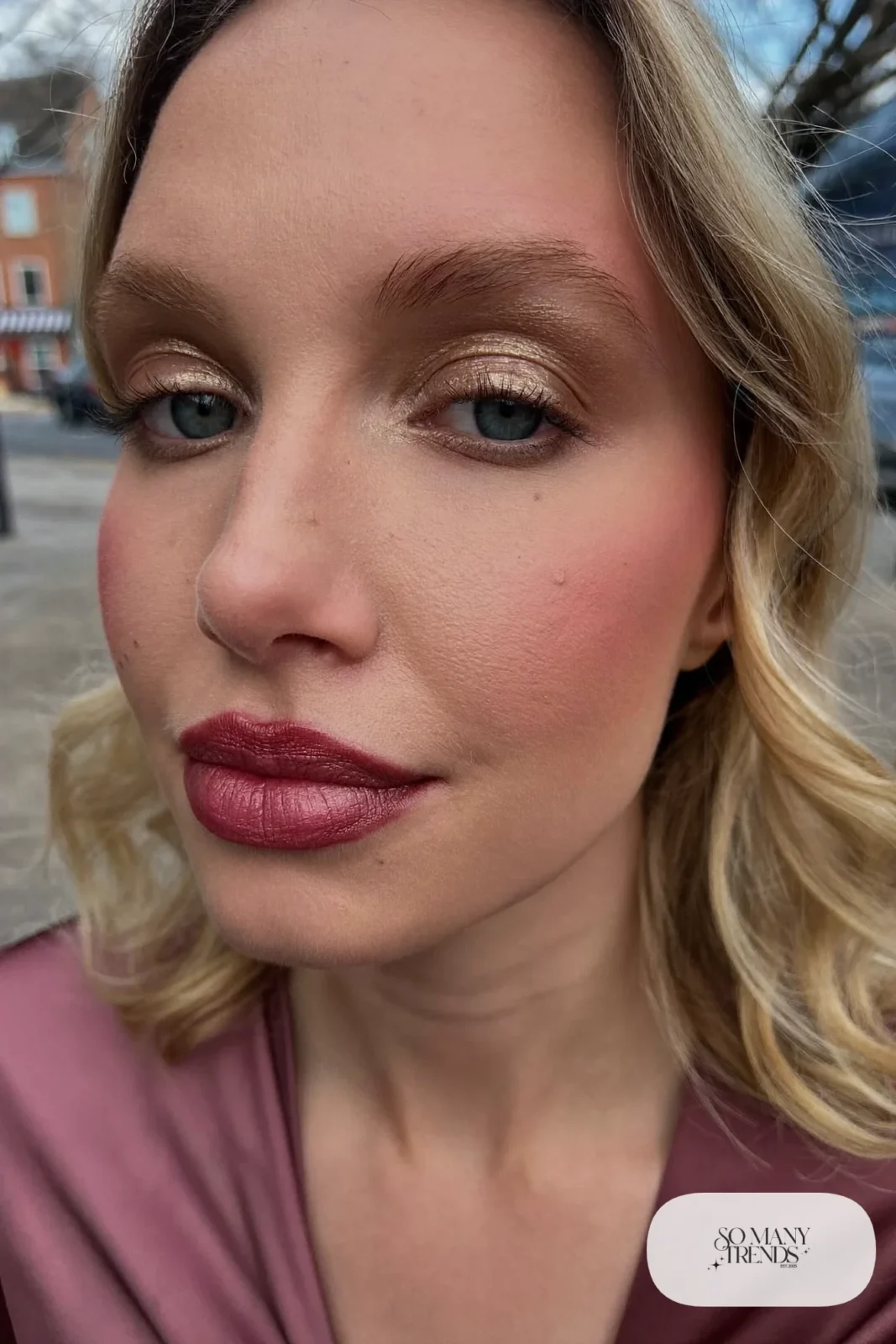 woman with a rosy cream blush flush and sheer berry balm, winter makeup look 7
