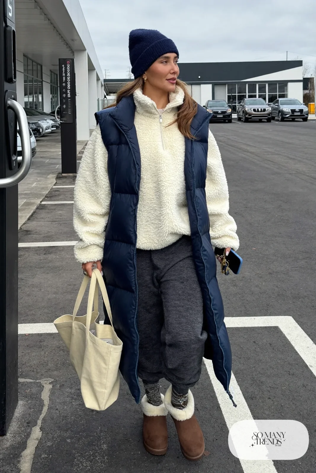 oversized cream sherpa half-zip pullover charcoal tapered joggers navy puffer vest brown shearling clogs navy beanie outfit 15