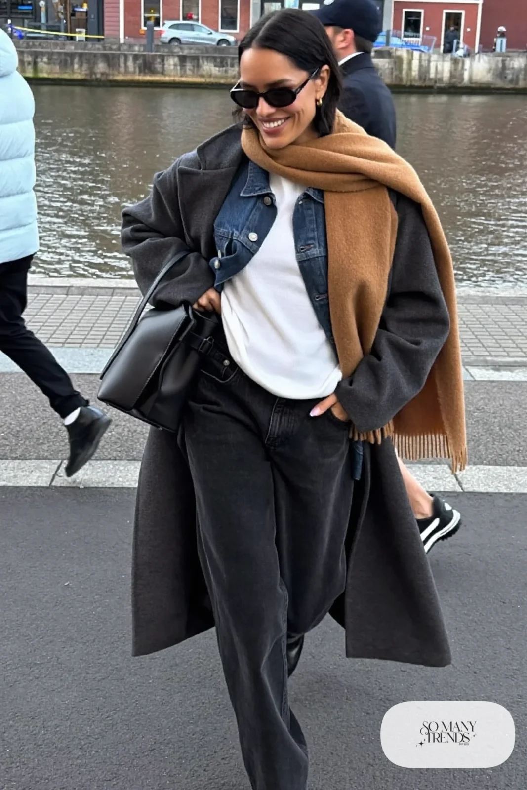 dark gray wool coat boxy medium-wash denim jacket white ribbed tee black wide-leg jeans black ankle boots camel scarf outfit 18