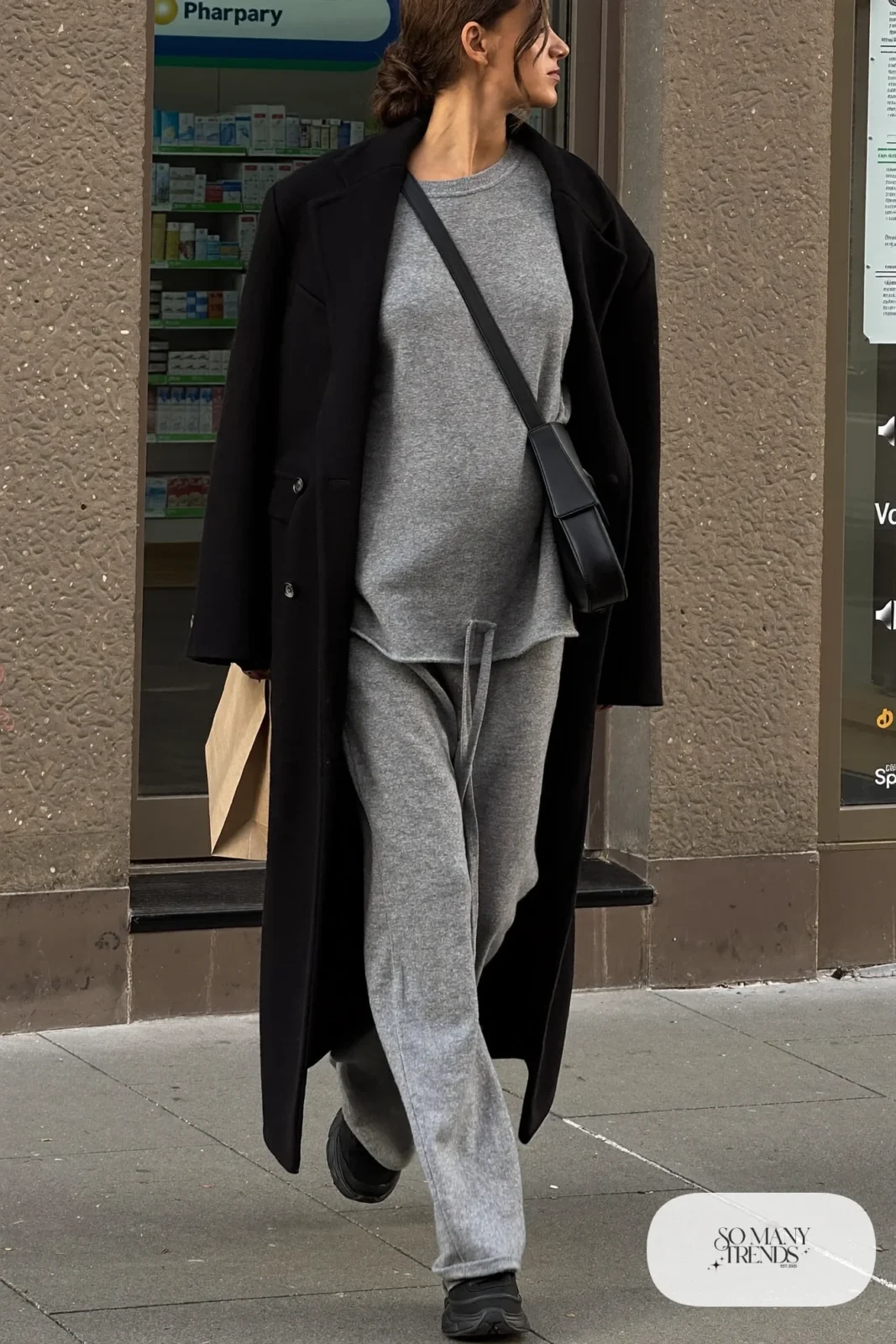pregnant woman in charcoal knit two-piece set, black wool coat, black sneakers and crossbody bag, outfit 9