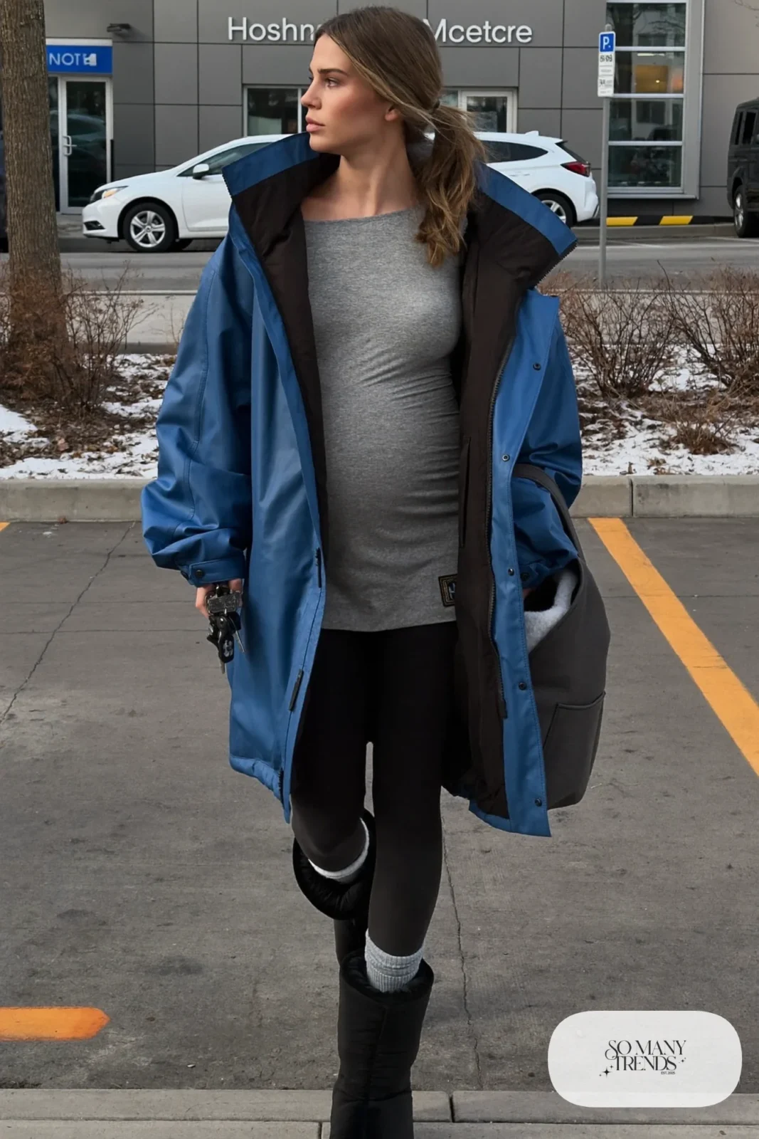 pregnant woman in cobalt blue parka, long gray tee, black maternity leggings and lined boots, outfit 12