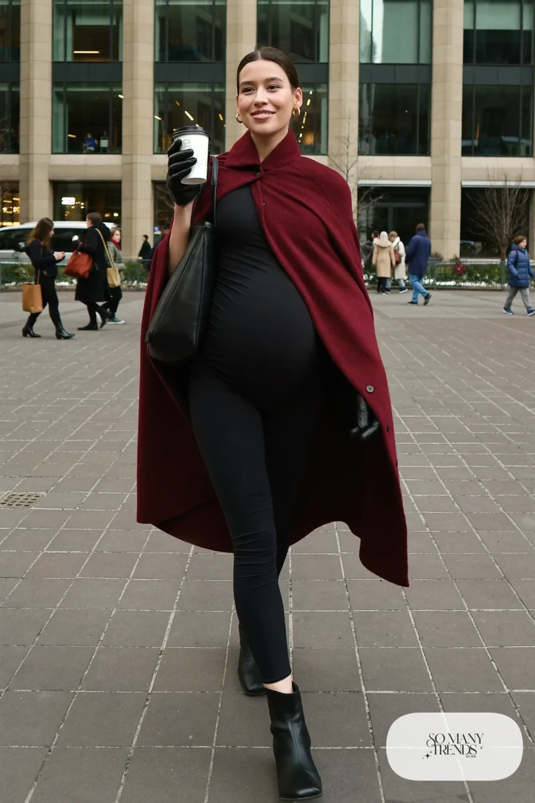 pregnant woman in burgundy wool cape, black maternity tee, black leggings and ankle boots, outfit 29