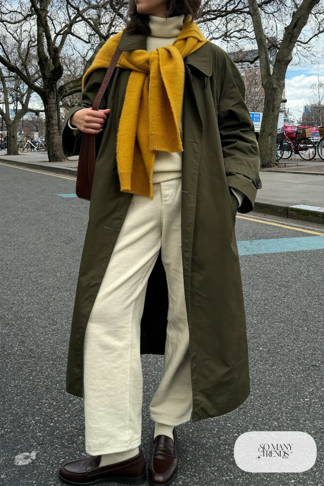 olive oversized trench coat mustard skinny scarf cream wide-leg pants brown loafers outfit 4