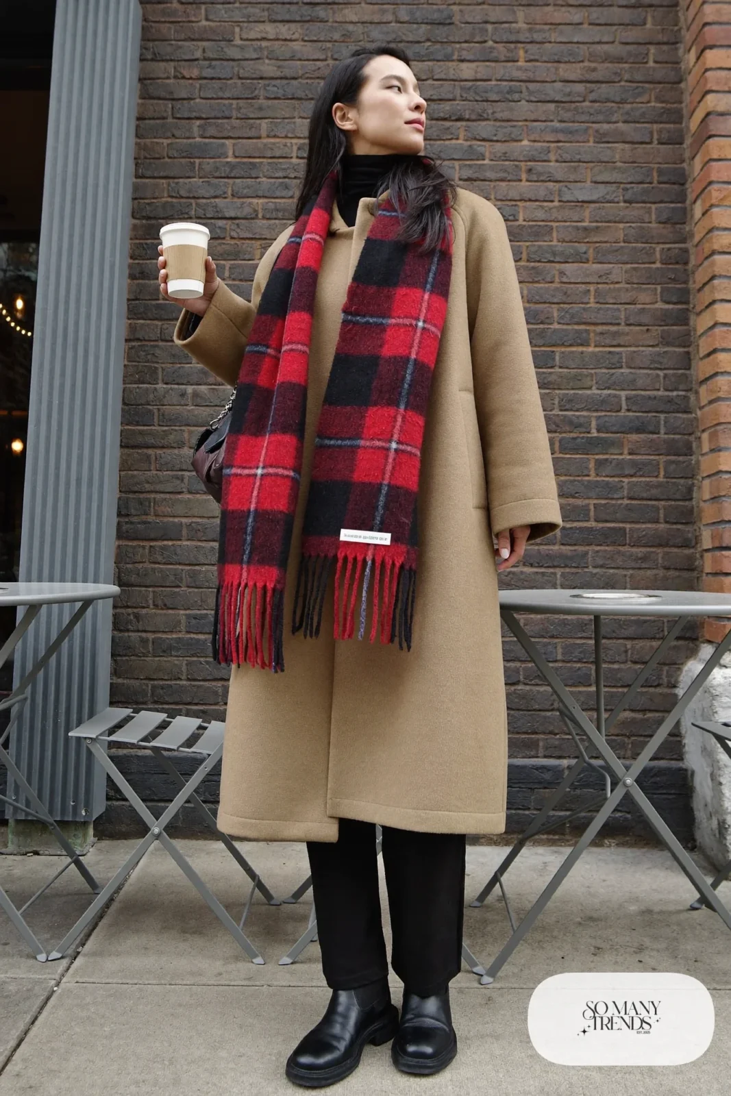 camel oversized coat red plaid scarf black turtleneck black pants black boots outfit 13