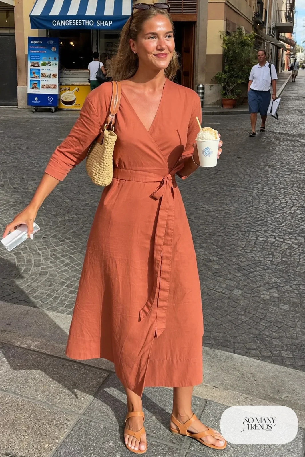terracotta linen wrap midi dress tan flat sandals straw bag sunglasses outfit 29