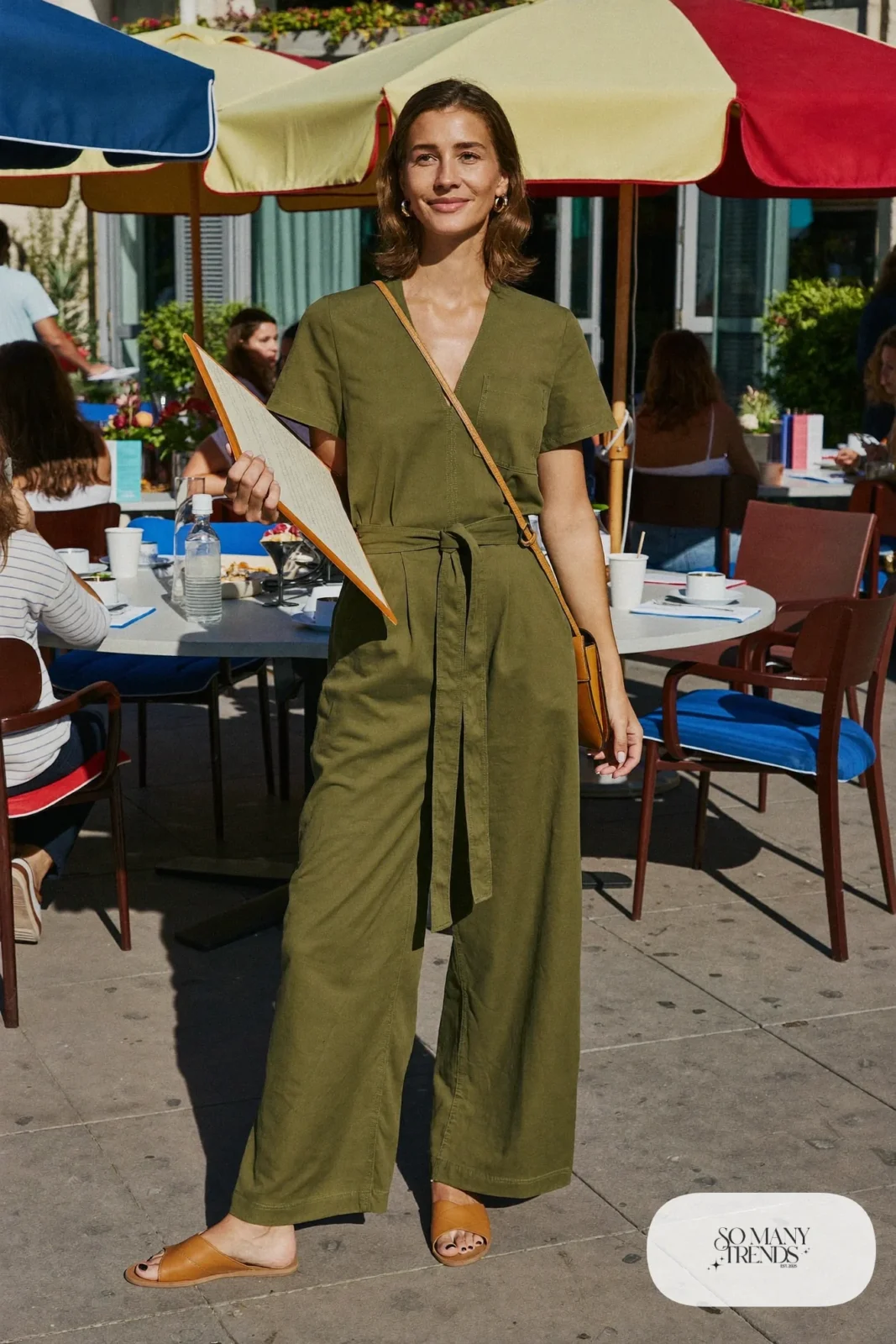 olive cotton tie-waist wide-leg jumpsuit gold hoops tan flat sandals crossbody bag outfit 35