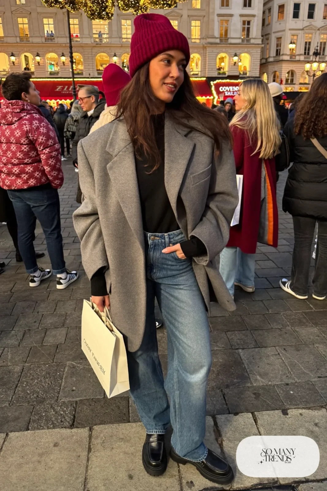 oversized gray wool blazer black ribbed top straight-leg jeans chunky loafers red knit beanie outfit 11