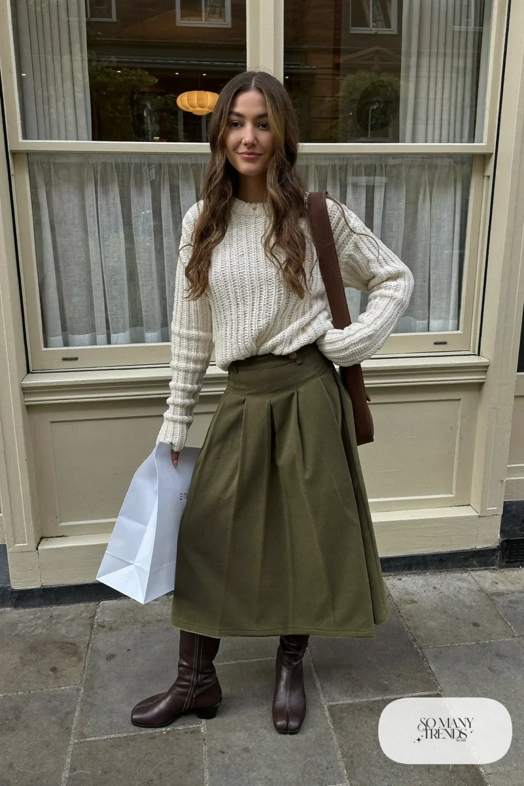 cream chunky sweater half-tucked olive pleated midi skirt brown flat boots crossbody outfit 16