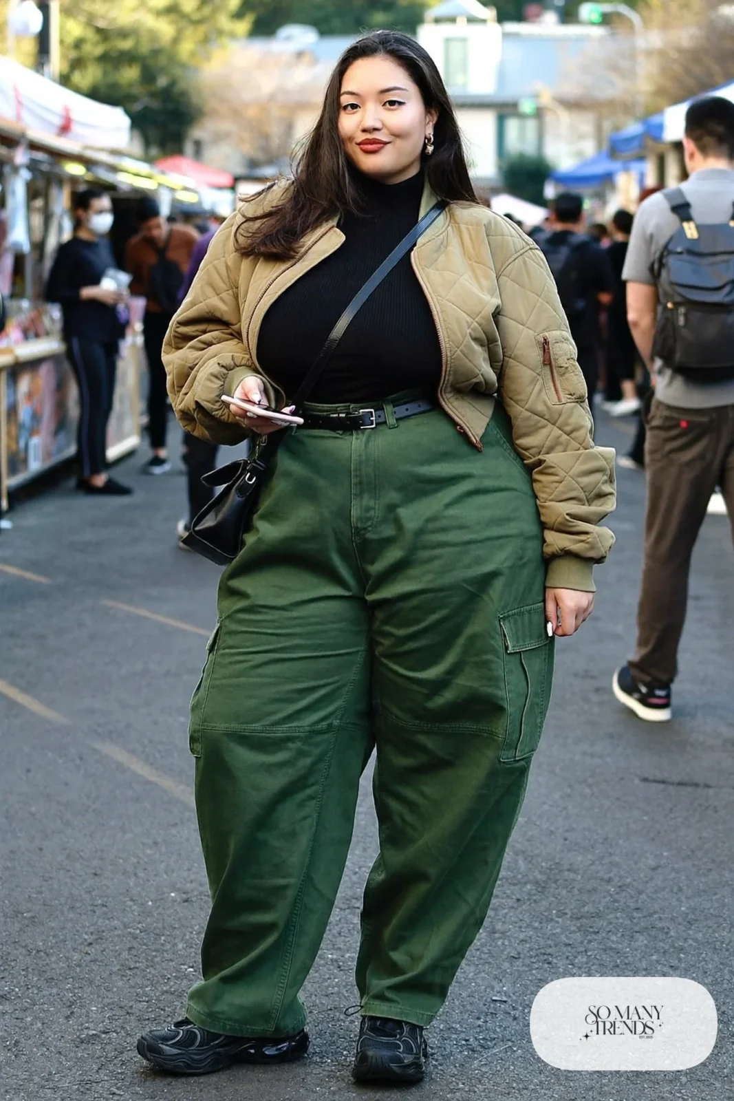 olive high-waisted cargo pants black ribbed tucked top cropped bomber jacket chunky sneakers outfit 18