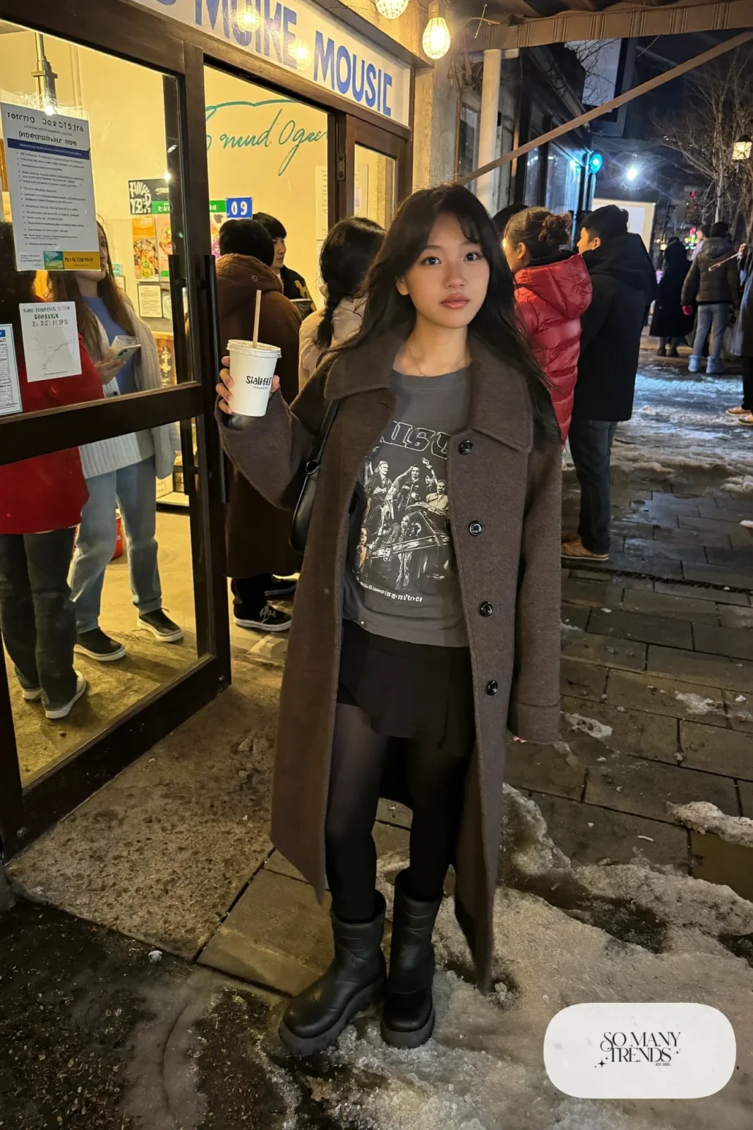 charcoal long wool coat faded band tee black mini skirt opaque tights chunky boots shoulder bag outfit 28
