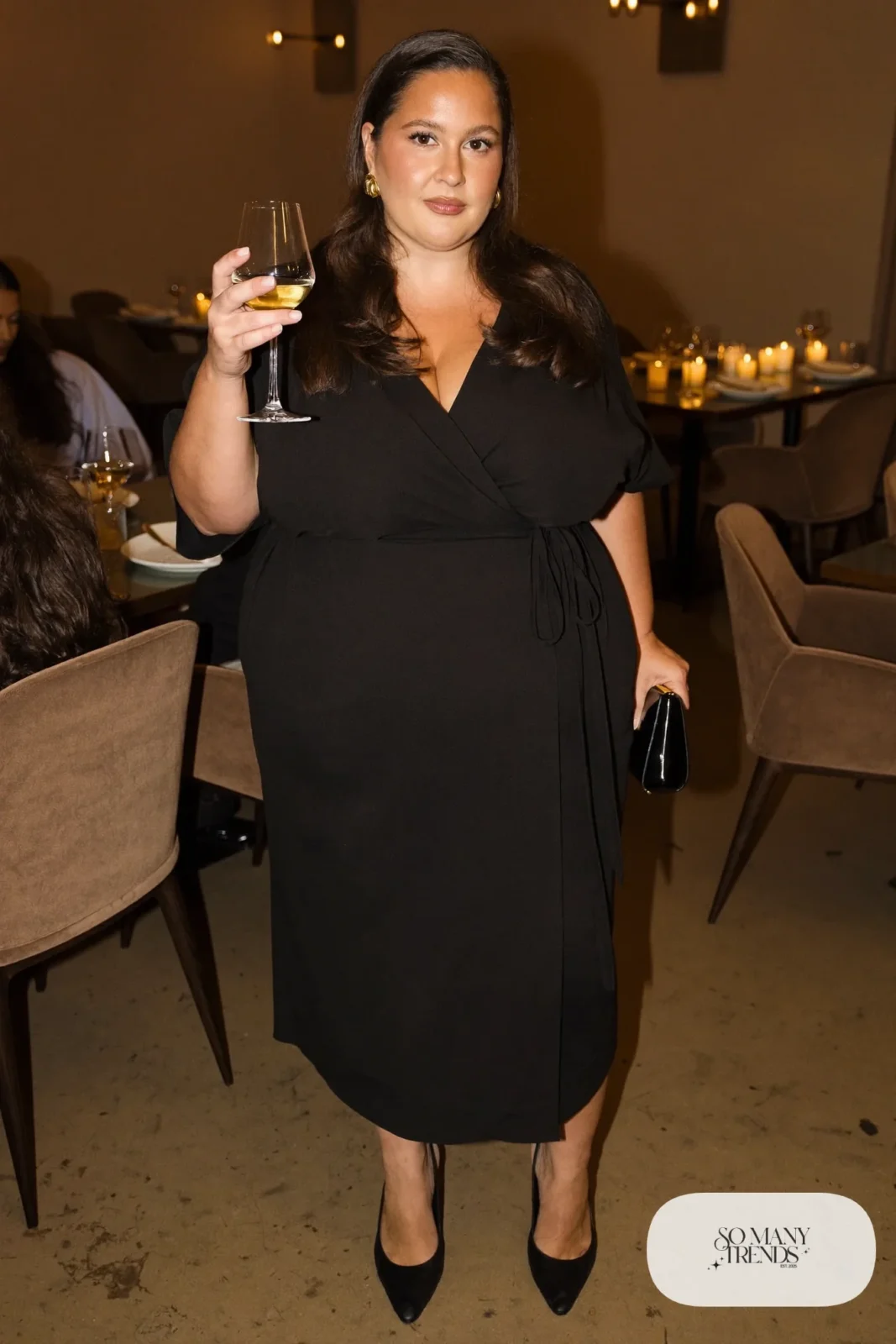 black crepe wrap midi dress, elbow sleeves, gold earrings, pointed black pumps outfit 24