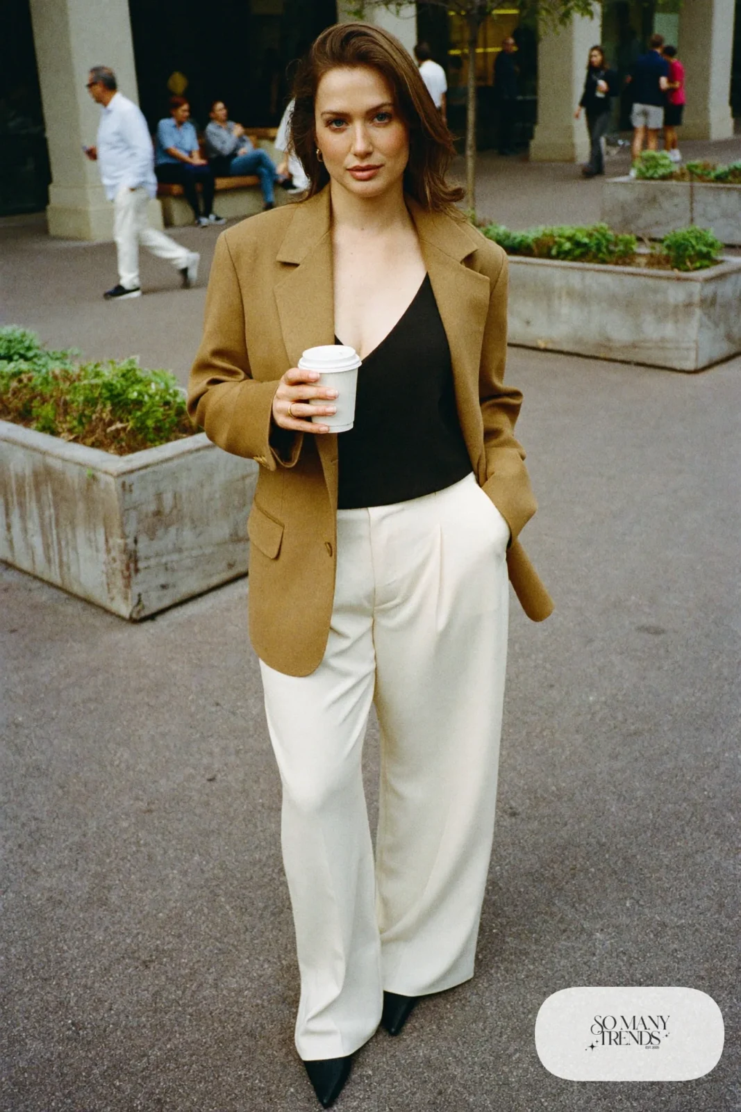 camel hip-length blazer, V-neck top, cream high-waisted wide-leg pants, pointed pumps outfit 1