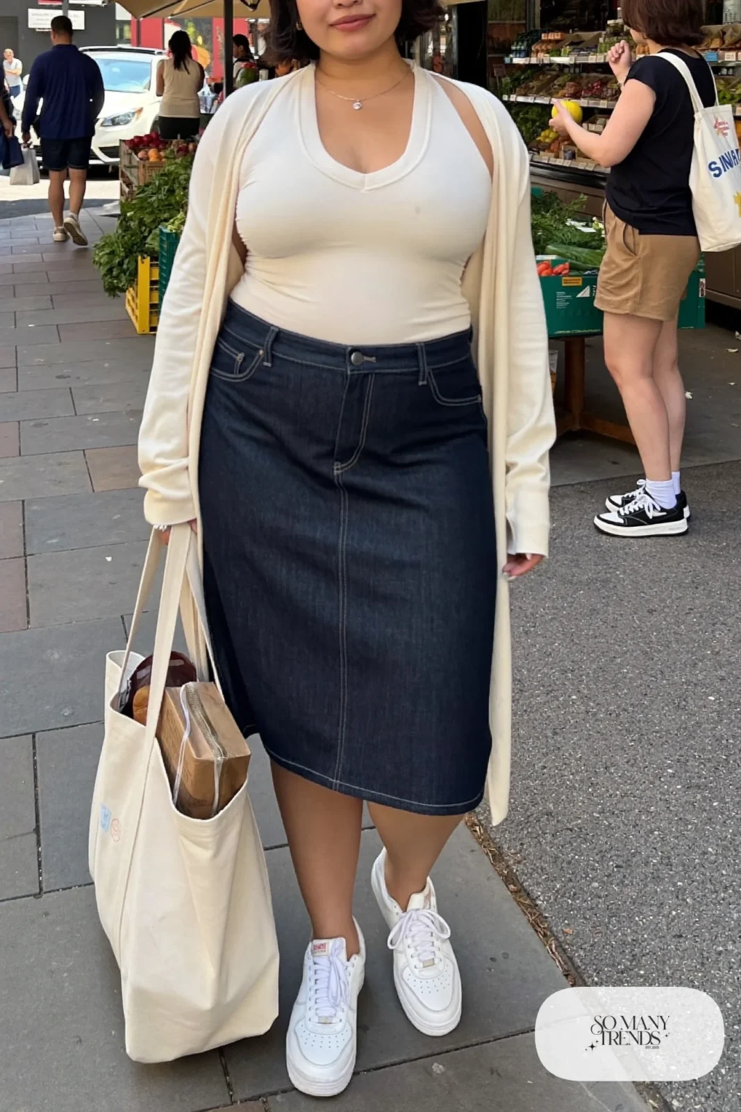 dark denim A-line midi skirt, cream V-neck tee tucked in, long open cream cardigan, white sneakers outfit 14