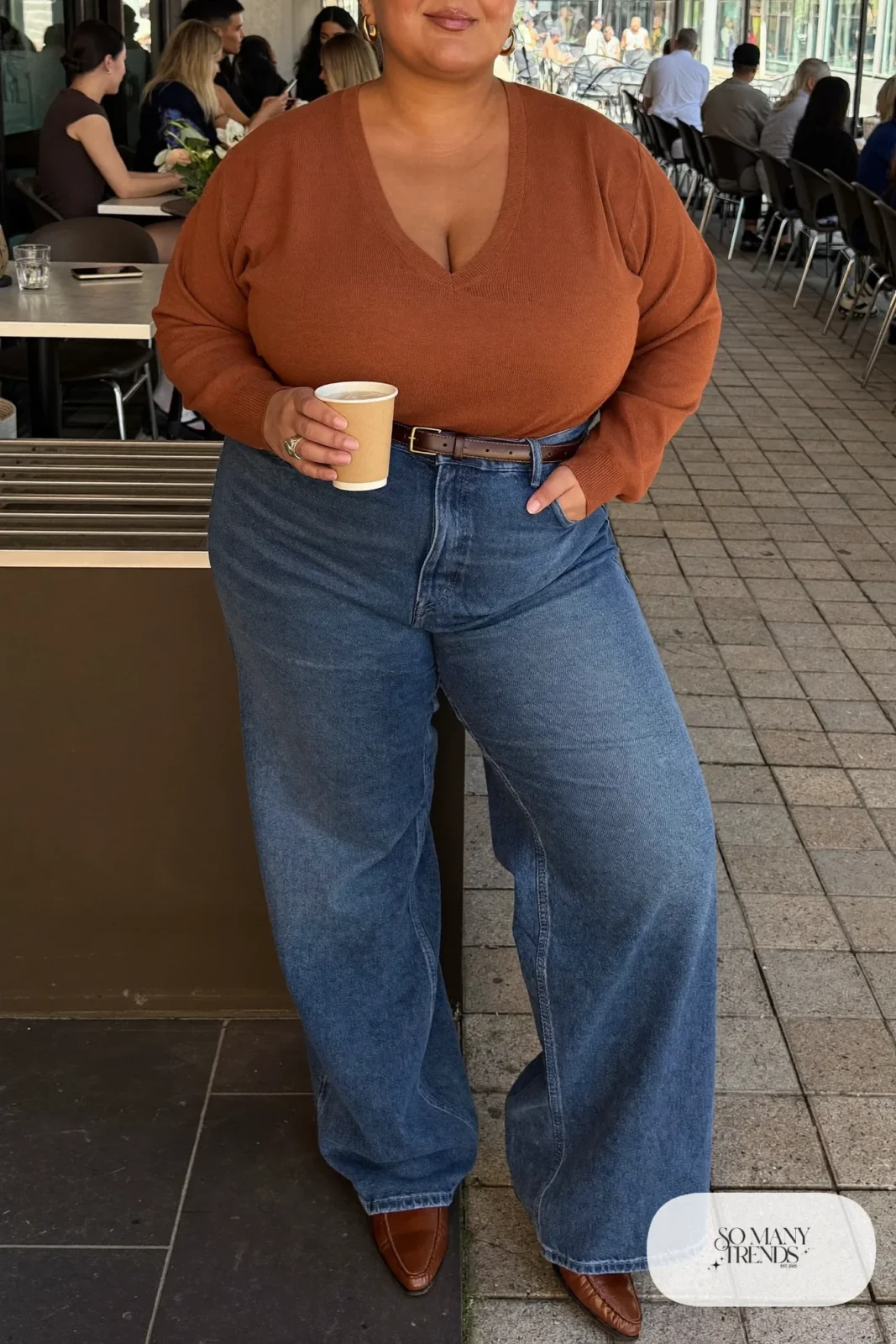 mid-blue high-waisted wide-leg jeans, rust V-neck sweater tucked in, brown belt, loafers outfit 19