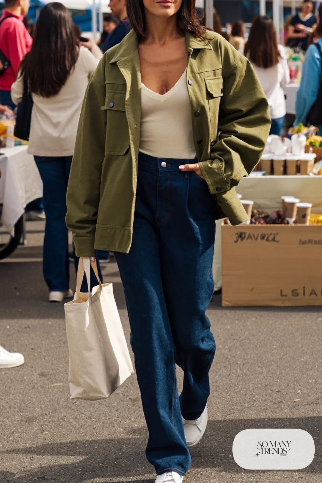 olive utility jacket, cream V-neck tee tucked in, dark high-waisted straight jeans, white sneakers outfit 22
