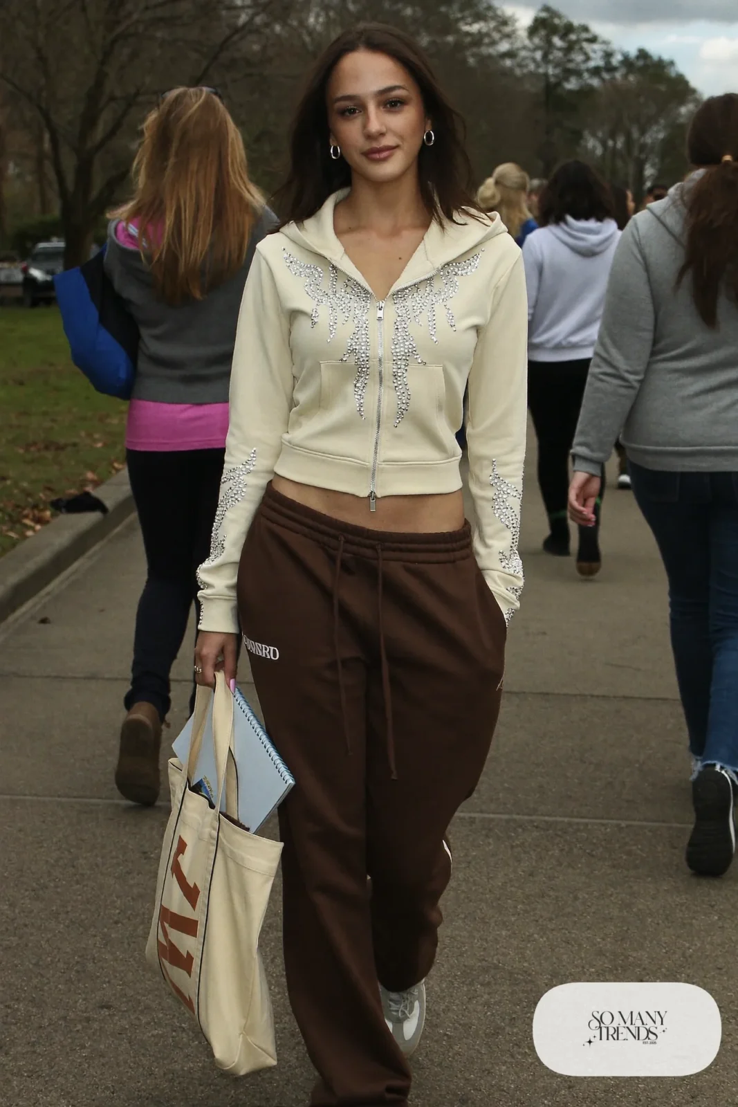 rhinestone cropped hoodie chocolate brown track pants silver hoops gray sneakers outfit 5