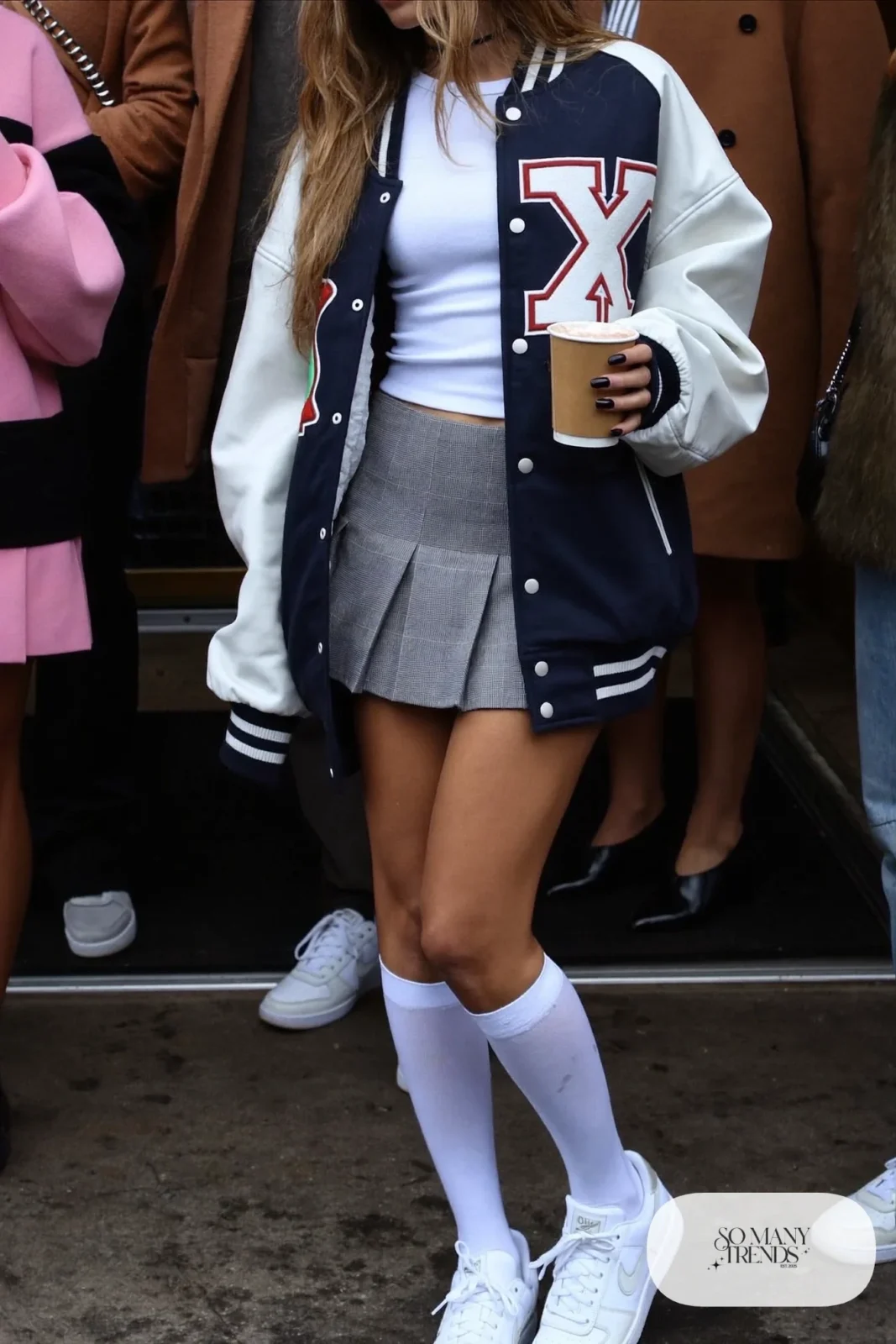 varsity jacket fitted white tee gray pleated mini skirt knee socks white sneakers outfit 15