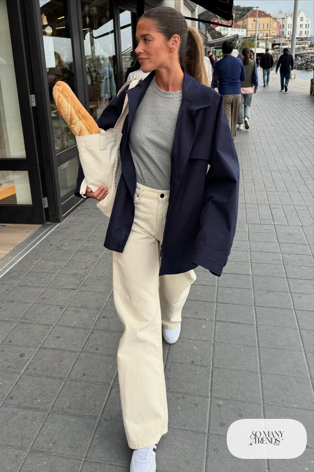 navy anorak jacket cream wide-leg jeans white leather sneakers gray cotton tee canvas tote outfit 13