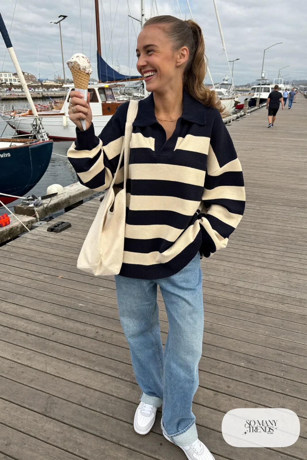 navy and cream wide stripe rugby sweater straight light jeans white leather sneakers canvas tote outfit 20
