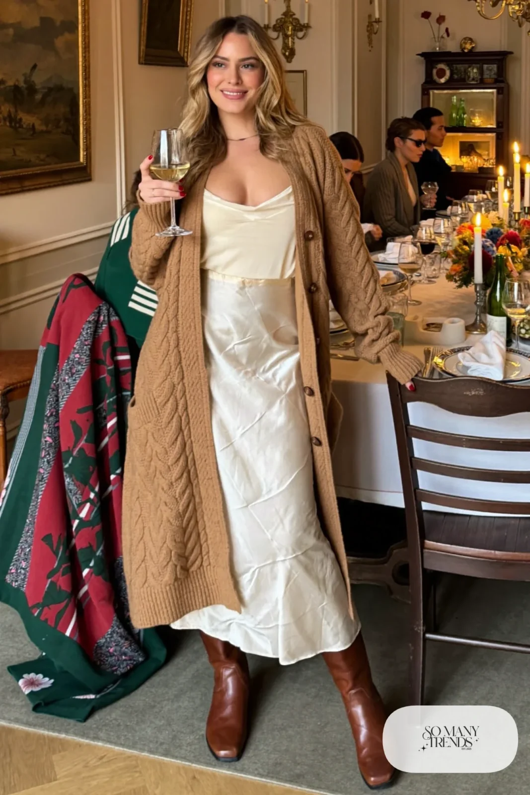 cream satin midi skirt oversized cable knit cardigan camel sheer tights tall brown boots outfit 25