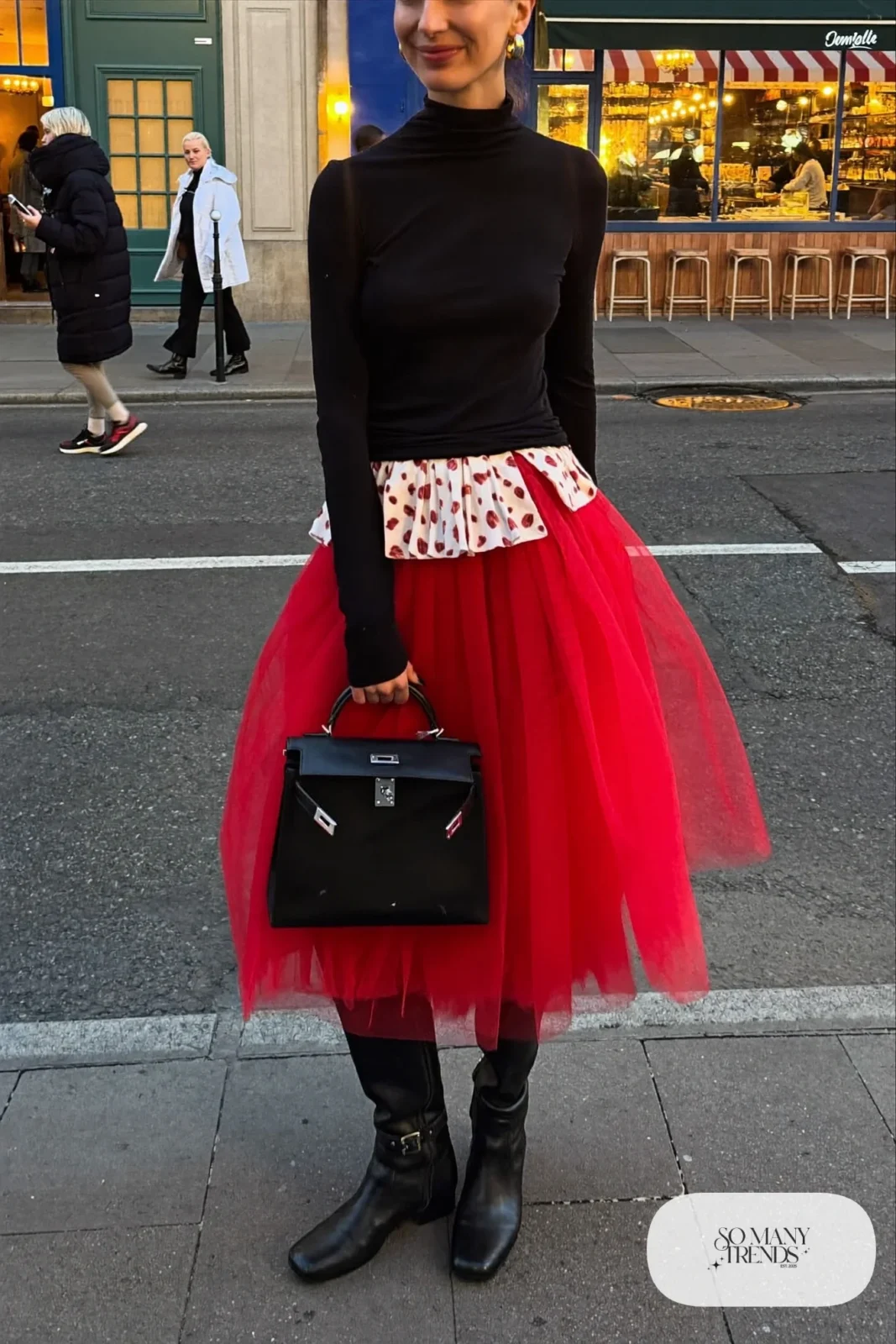 cherry red tulle midi skirt black turtleneck tall black boots structured black bag outfit 5