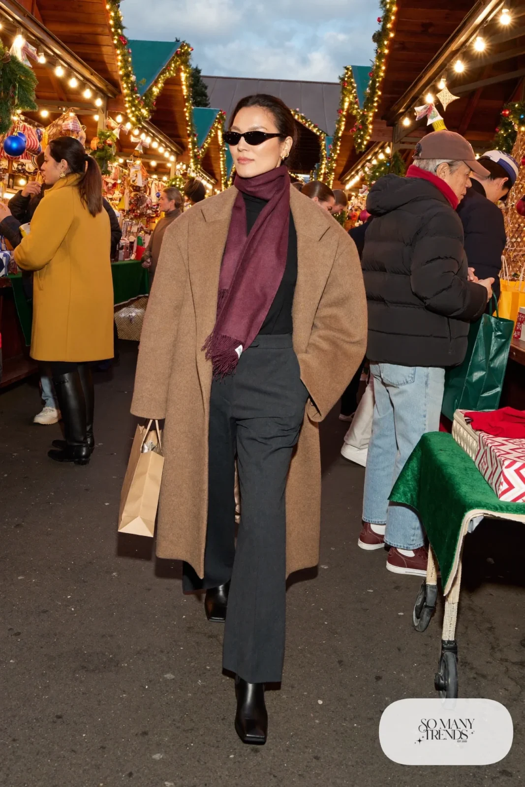 camel oversized coat charcoal wide-leg pants burgundy scarf black boots christmas market outfit 2