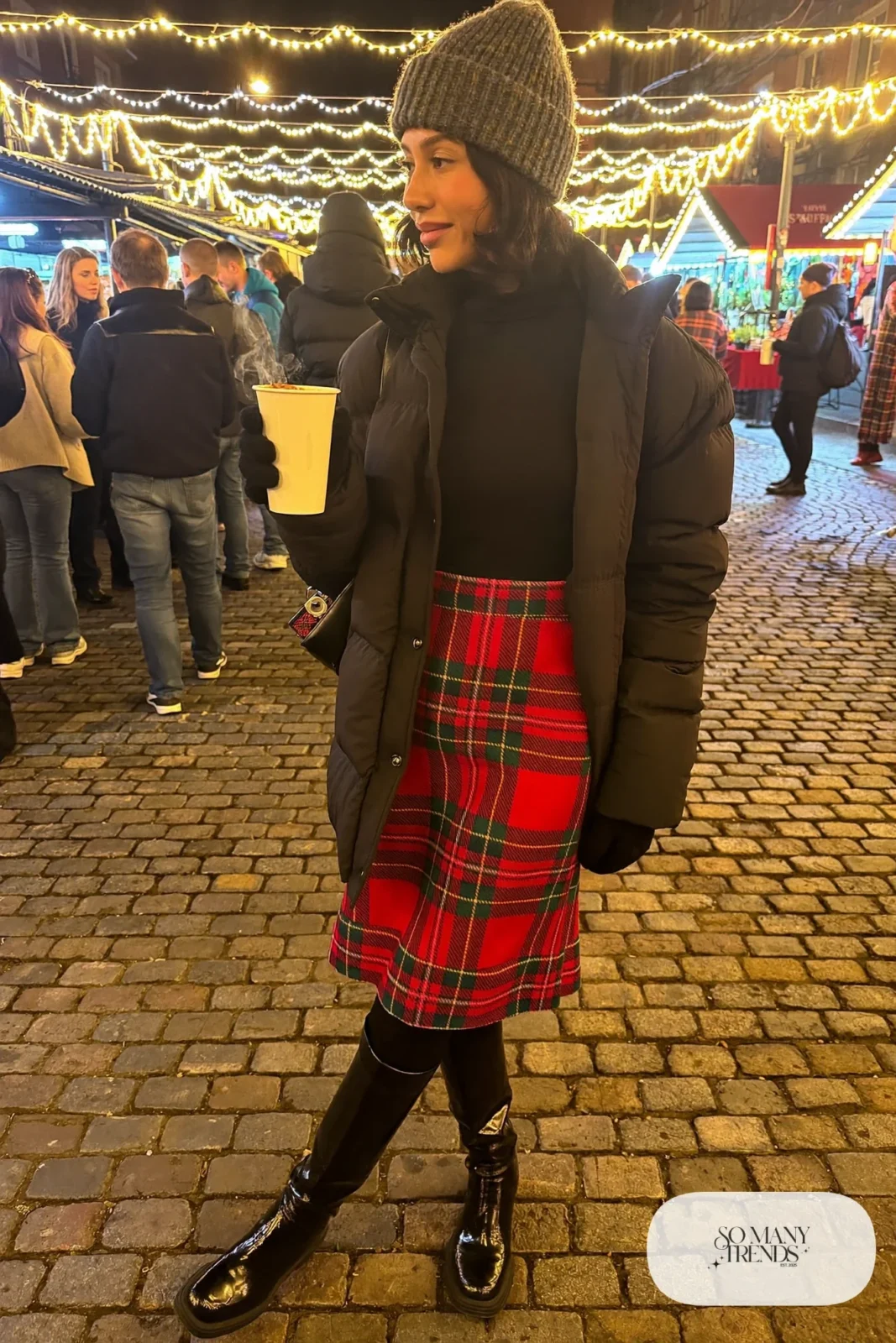 red green plaid wool midi skirt black turtleneck black tights knee-high boots black puffer christmas market outfit 20