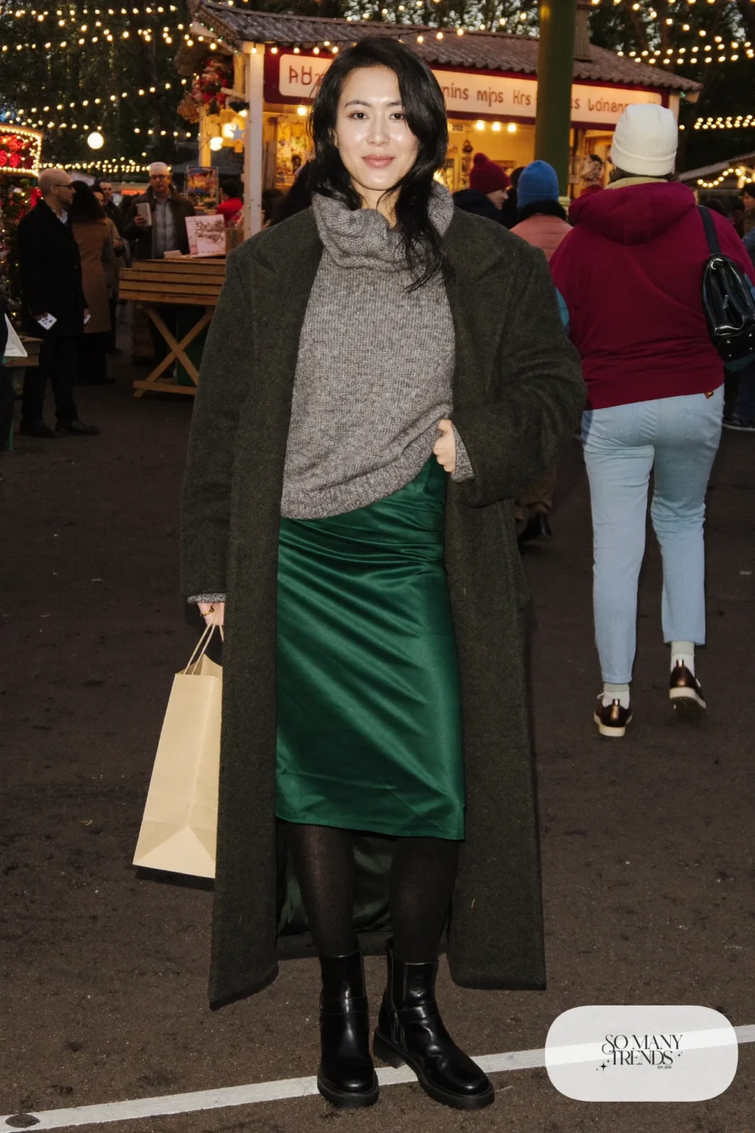deep green satin midi skirt chunky gray sweater long gray coat lug-sole boots wool tights christmas market outfit 22