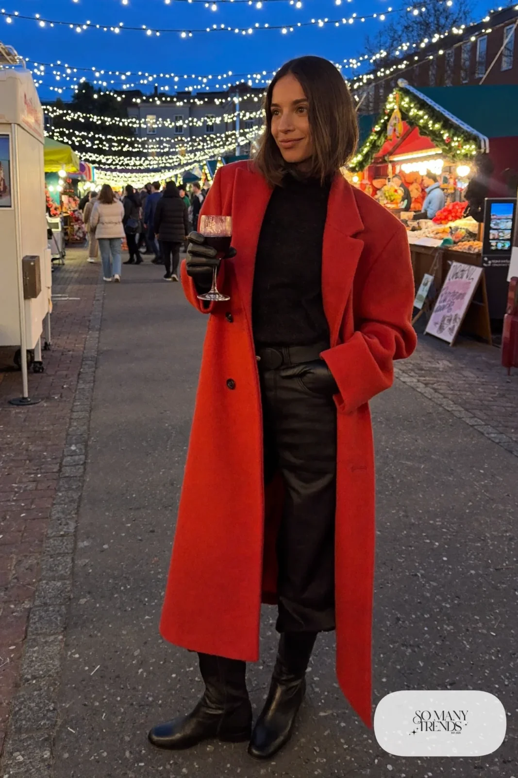red long wool coat black knit sweater black wide-leg pants black boots black gloves christmas market outfit 25